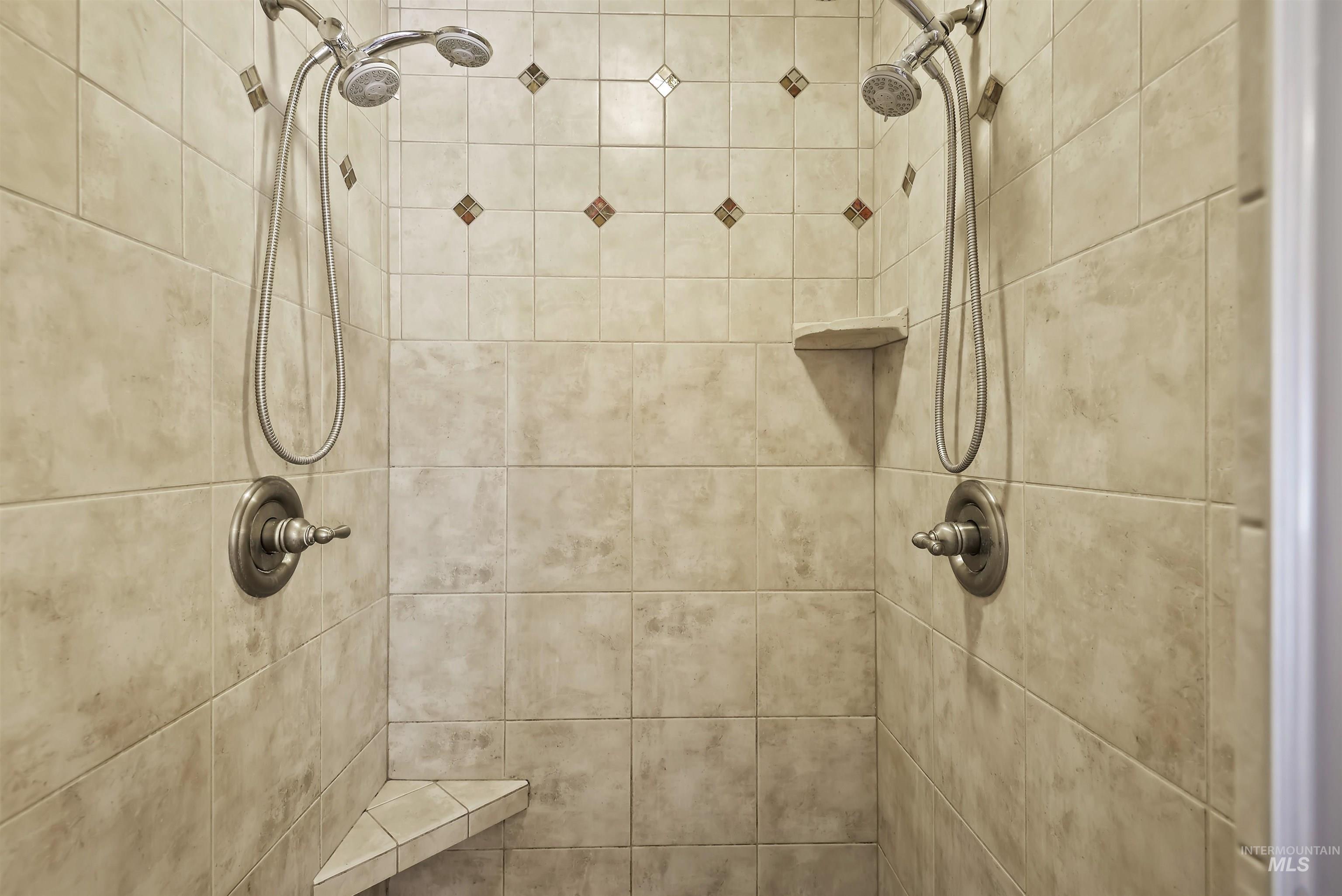 Full bathroom with a tile shower