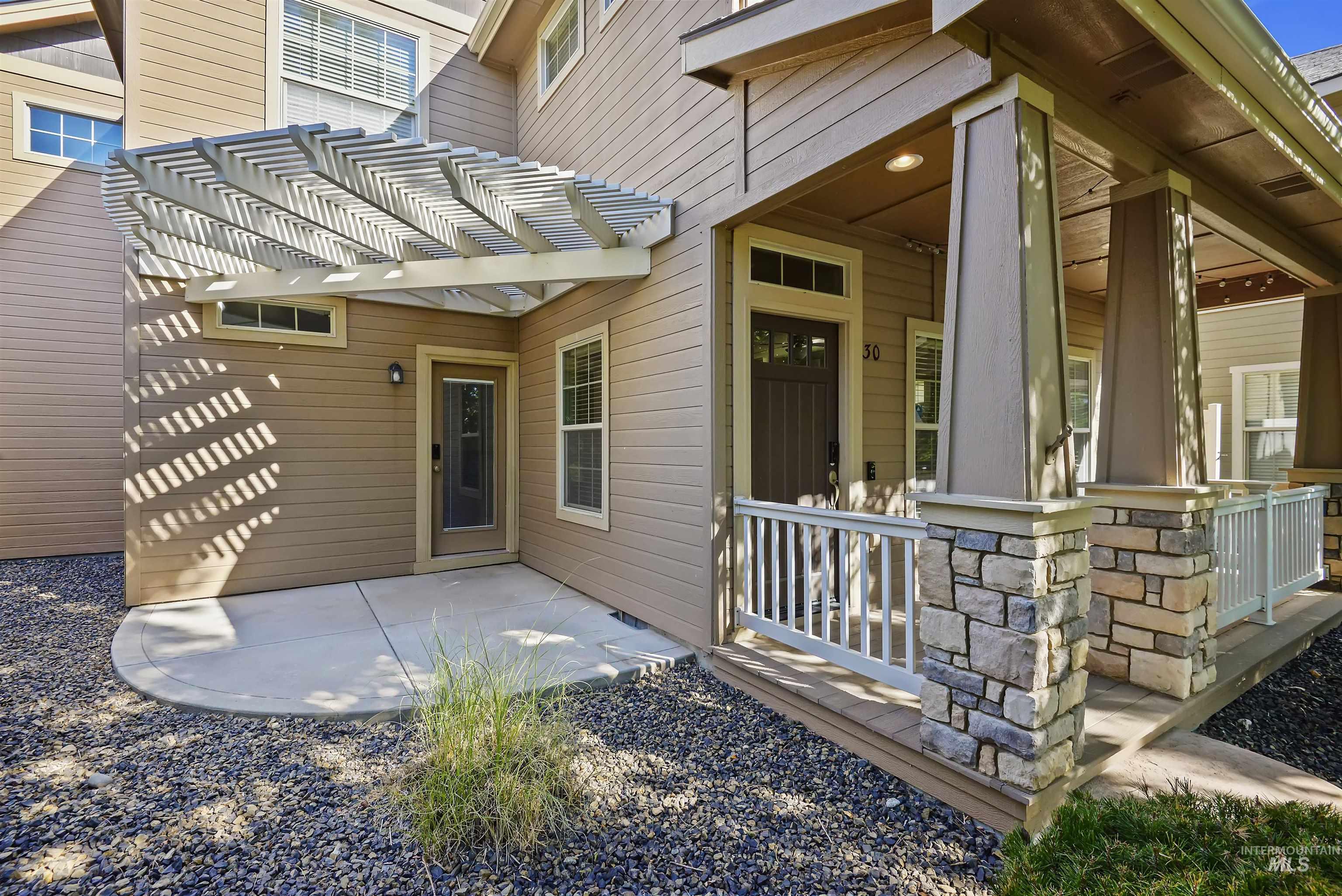 Property entrance featuring a patio and a pergola