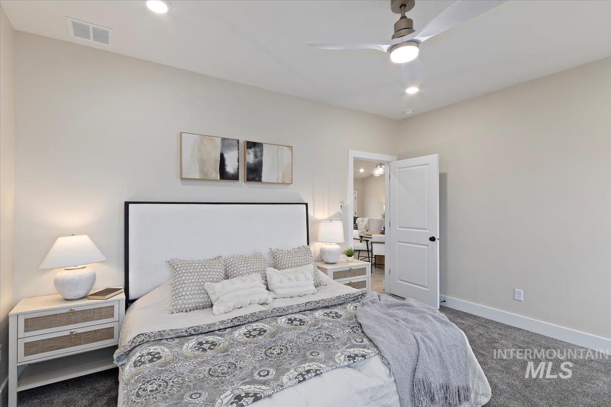 Bedroom featuring ceiling fan, carpet floors, and recessed lighting