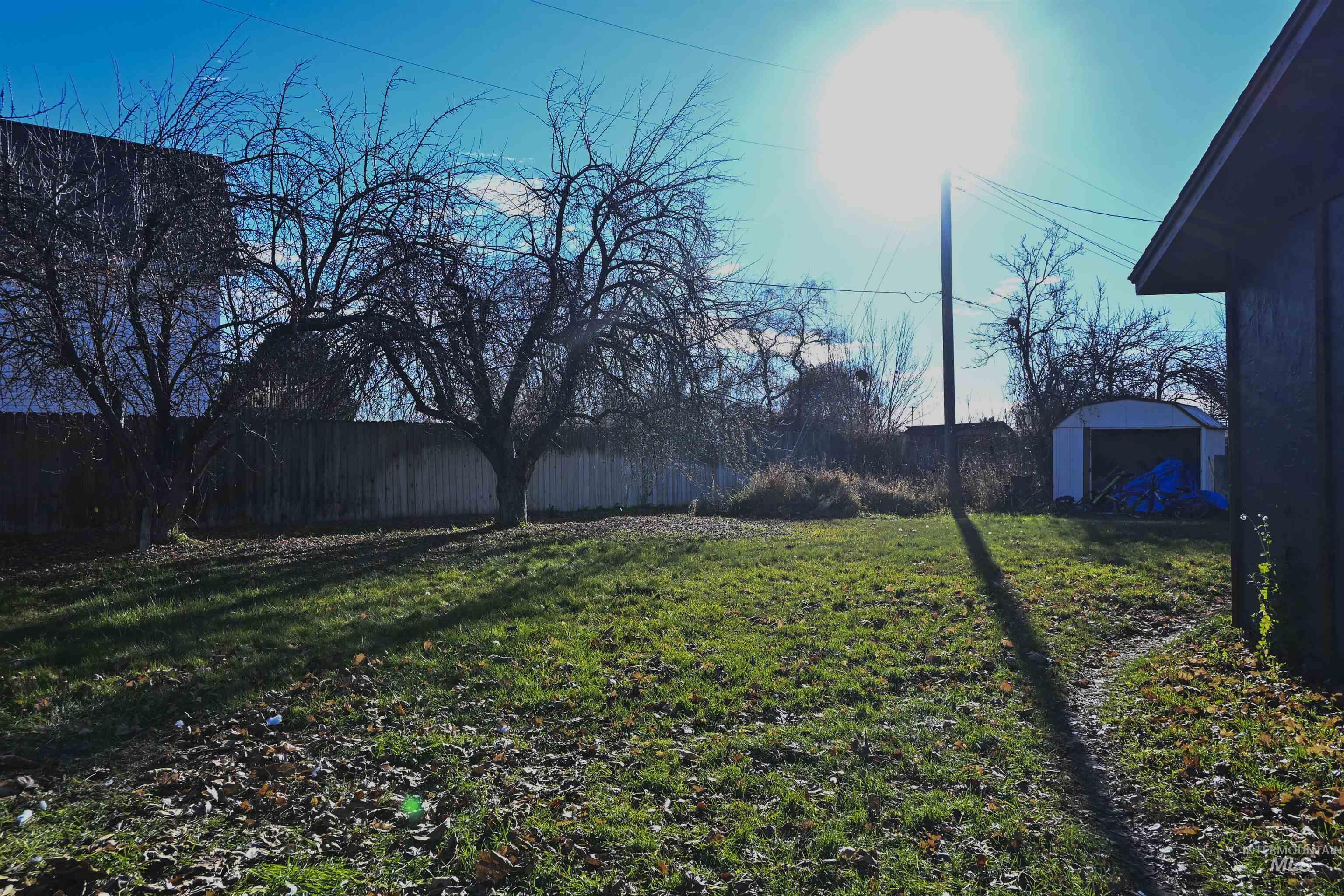 View of yard featuring a storage unit