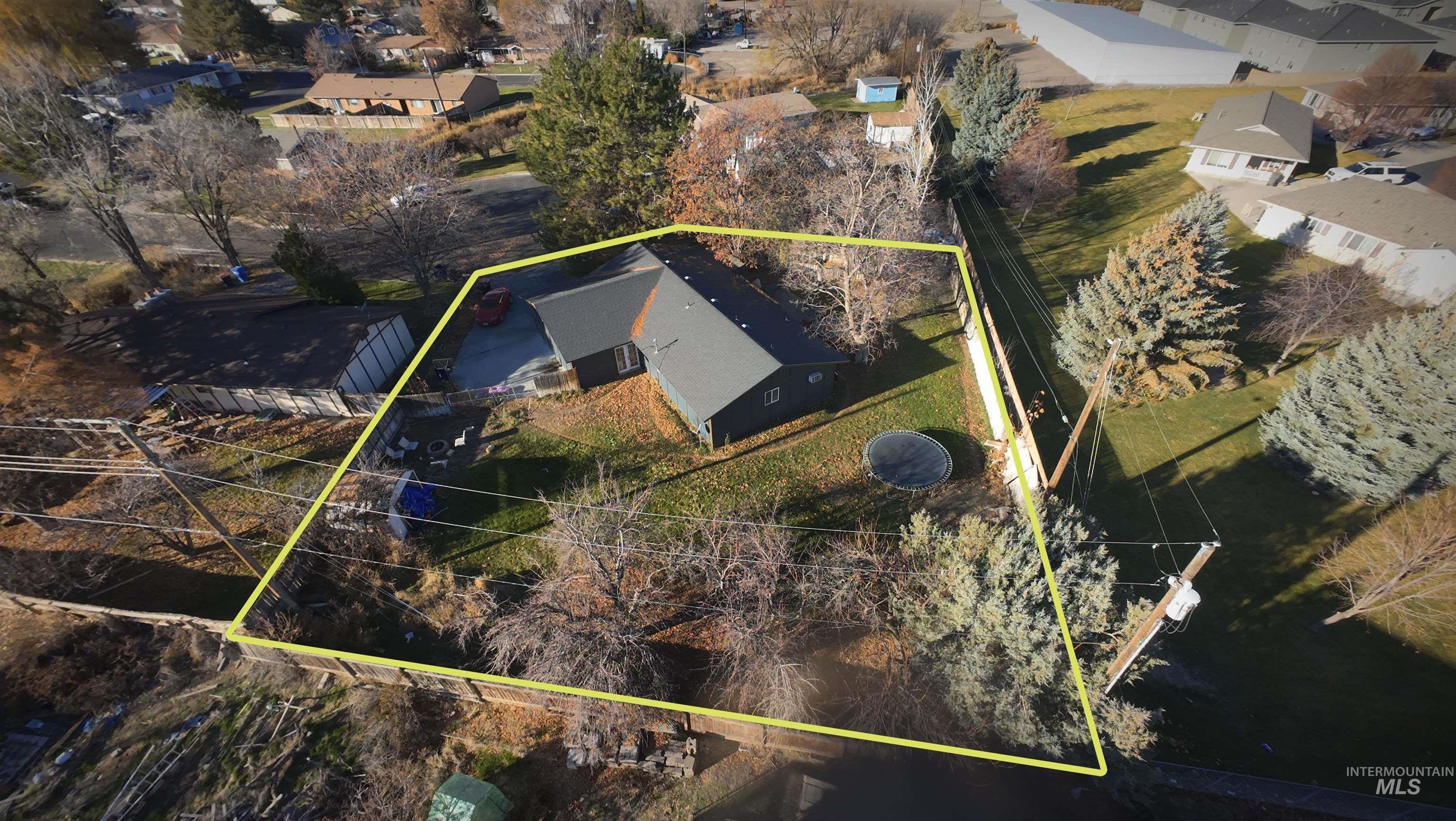 Aerial view of residential area with property boundaries highlighted
