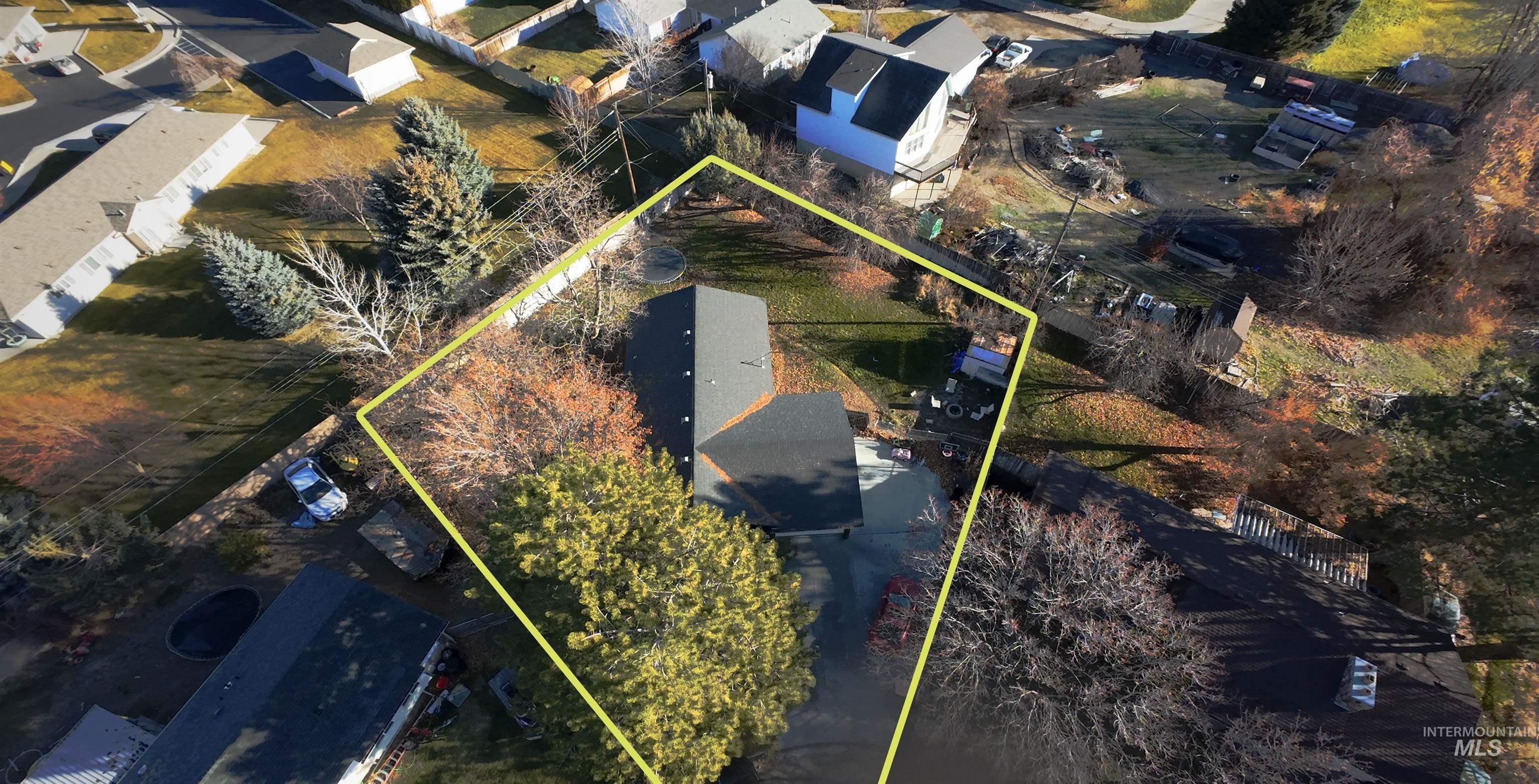 Aerial perspective of suburban area with property boundaries highlighted
