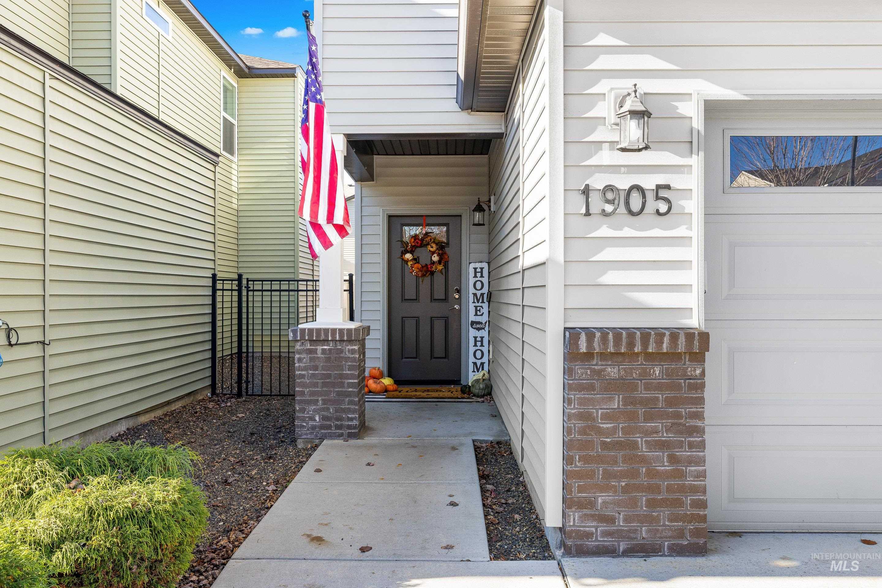 View of exterior entry with a garage