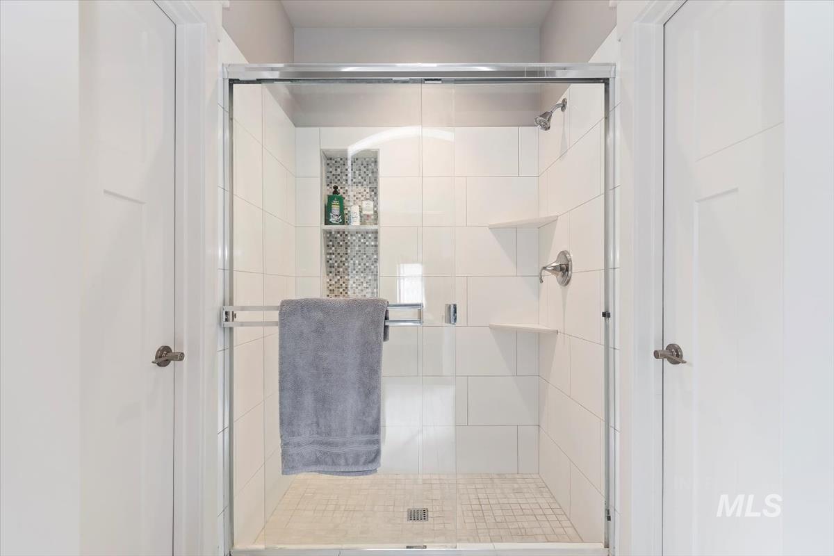 Bathroom featuring a shower stall