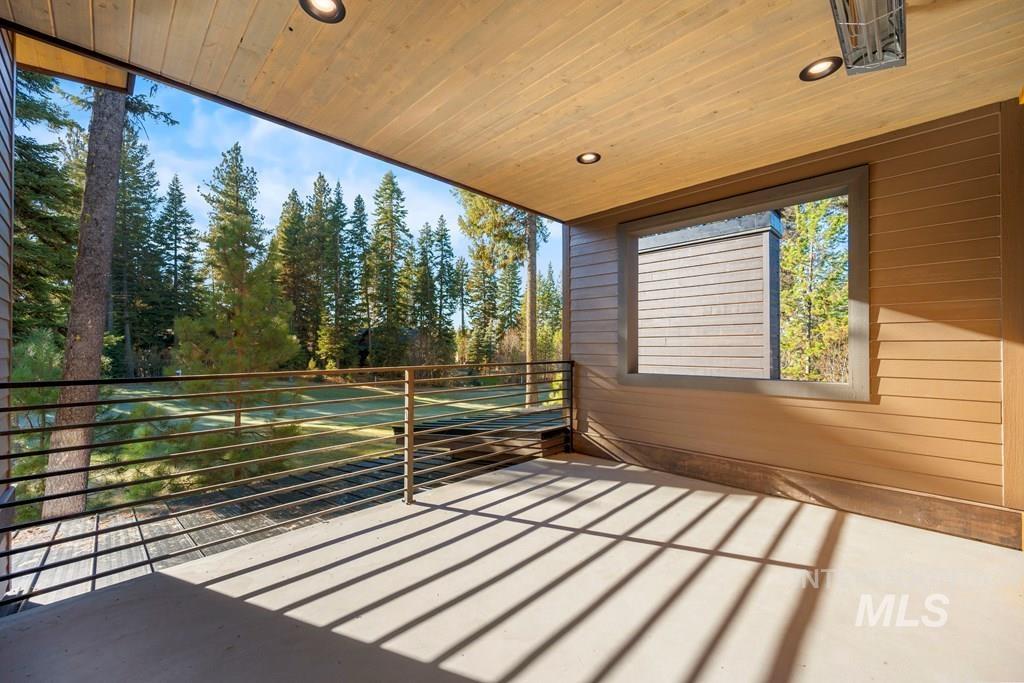 Wooden terrace featuring a patio area