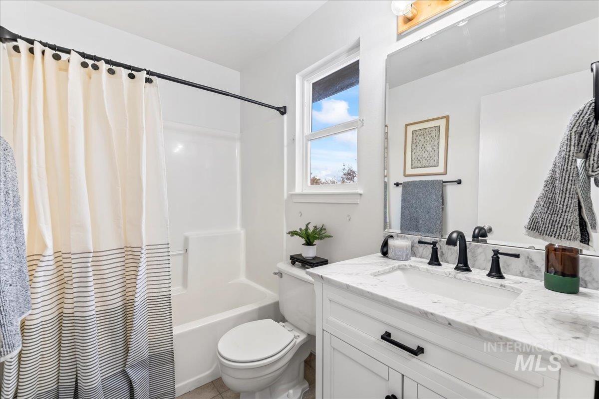 Full bathroom featuring vanity and shower / bath combo