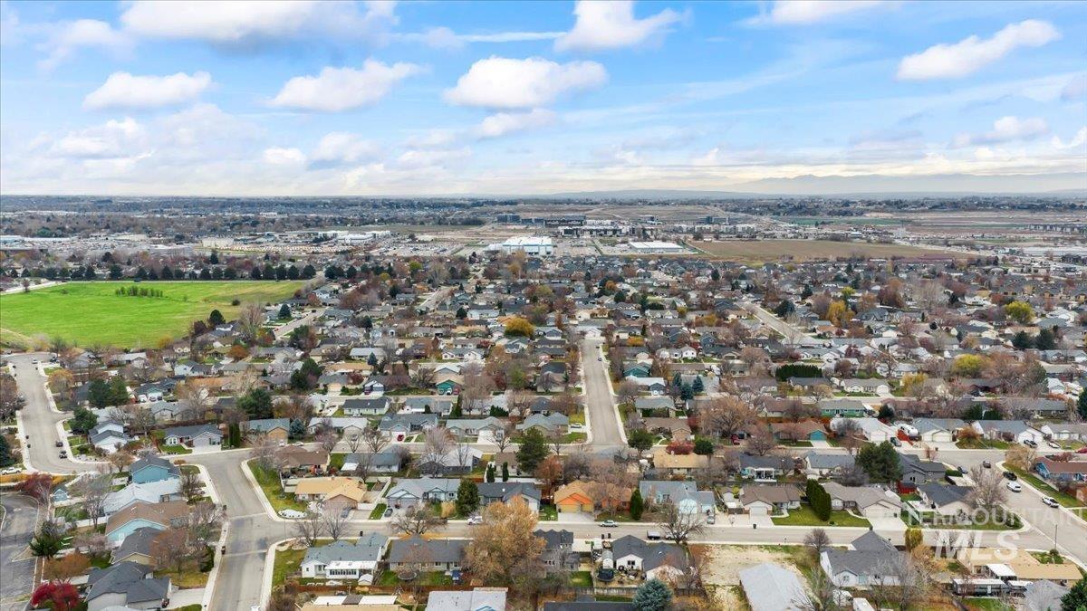 View of property location with nearby suburban area