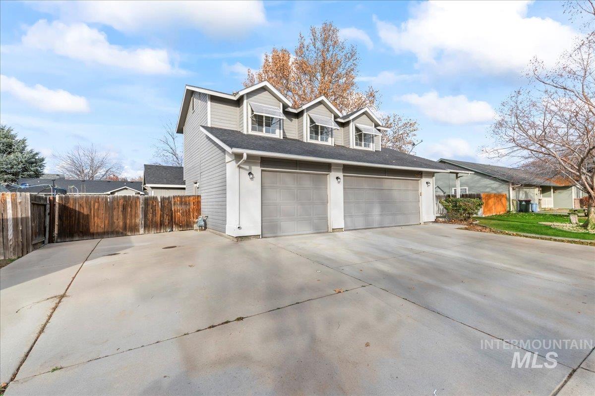View of home's exterior featuring driveway