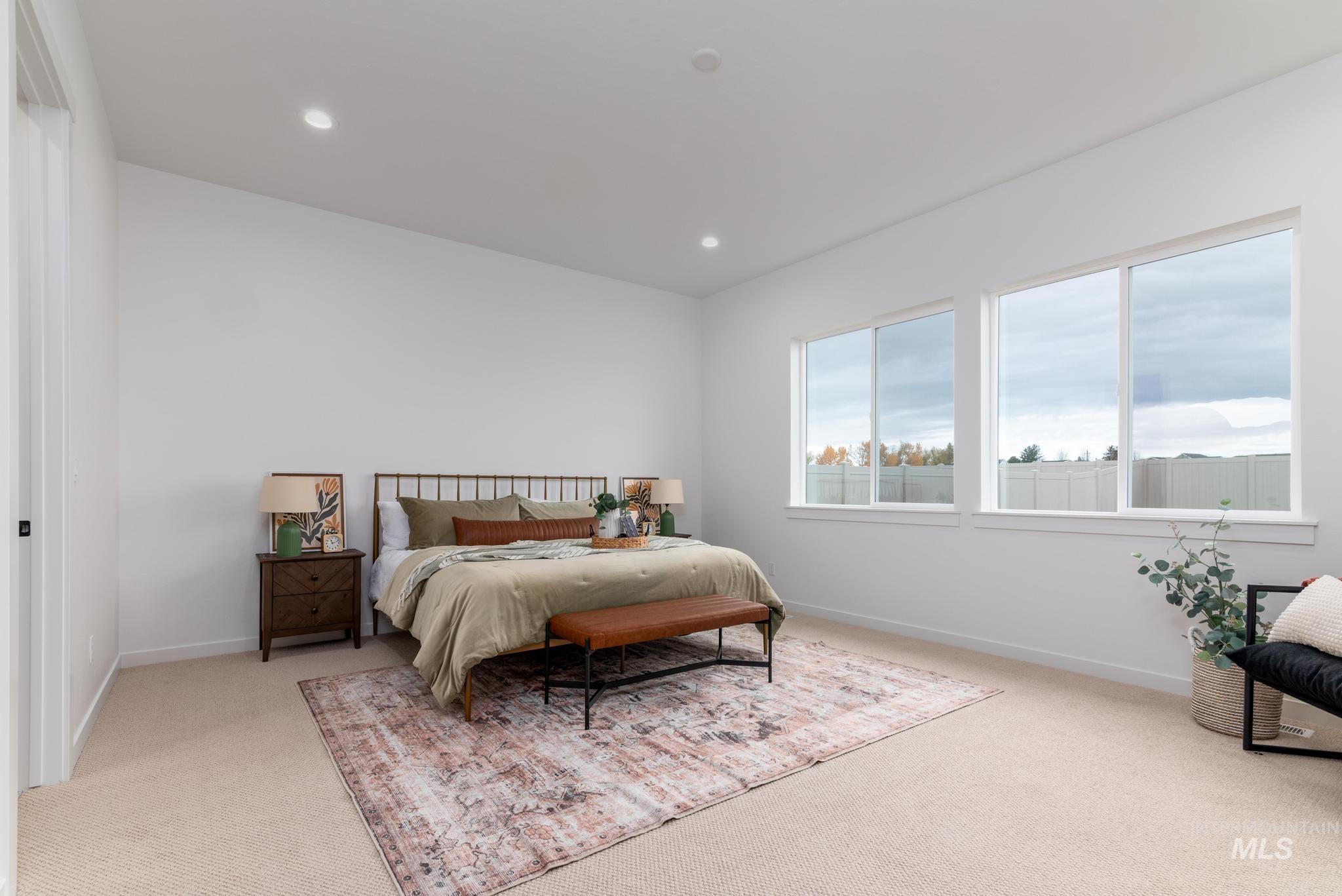 Bedroom featuring light colored carpet and recessed lighting