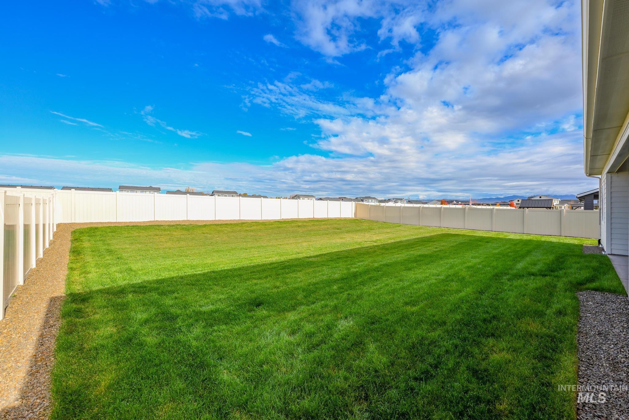 View of fenced backyard