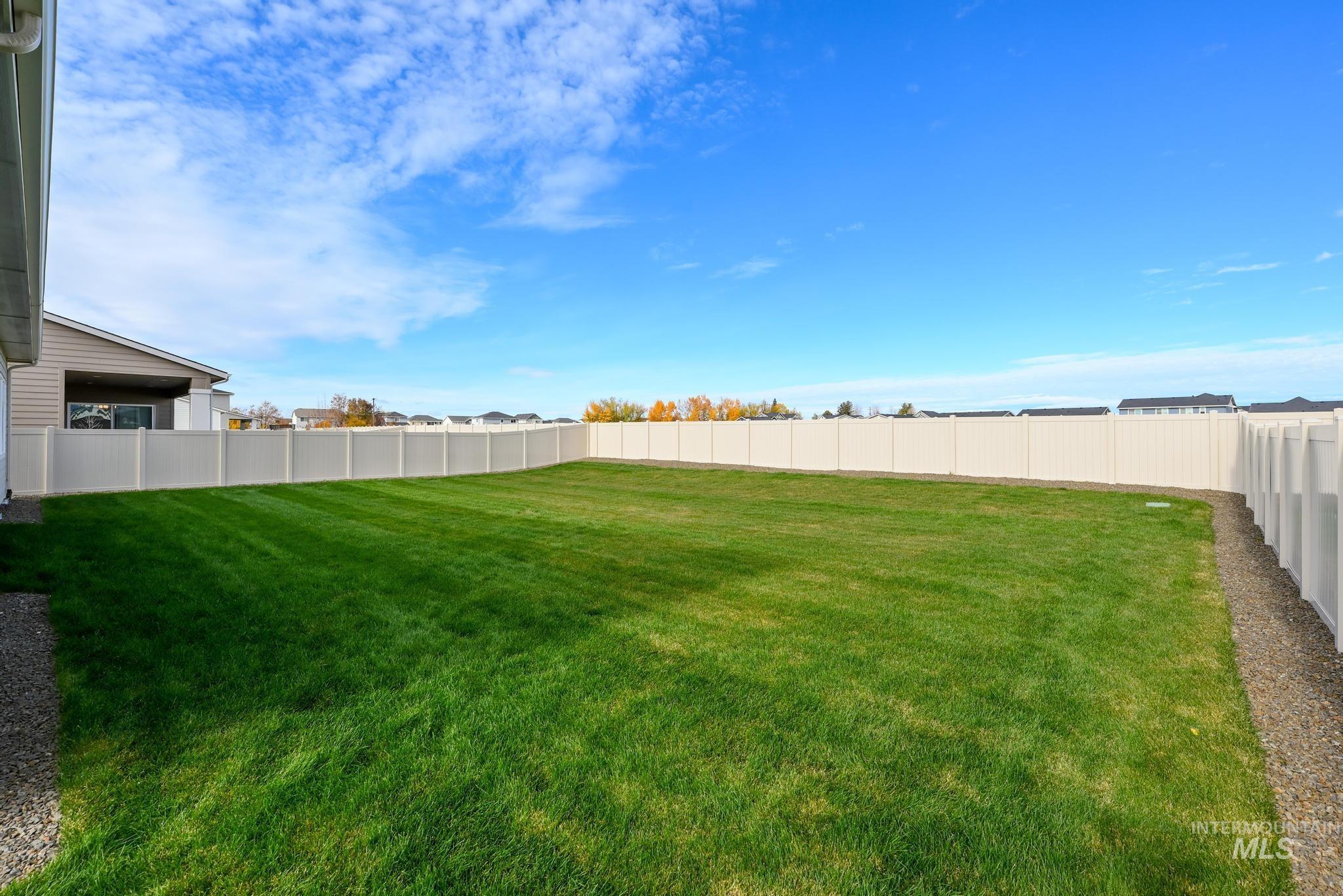 View of fenced backyard