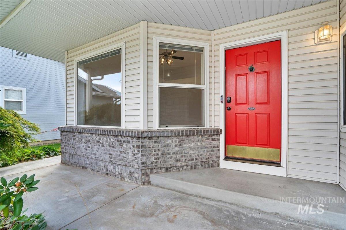 Property entrance with covered porch