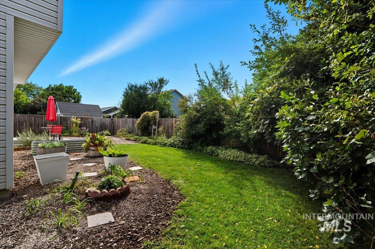 Fenced backyard featuring a patio area