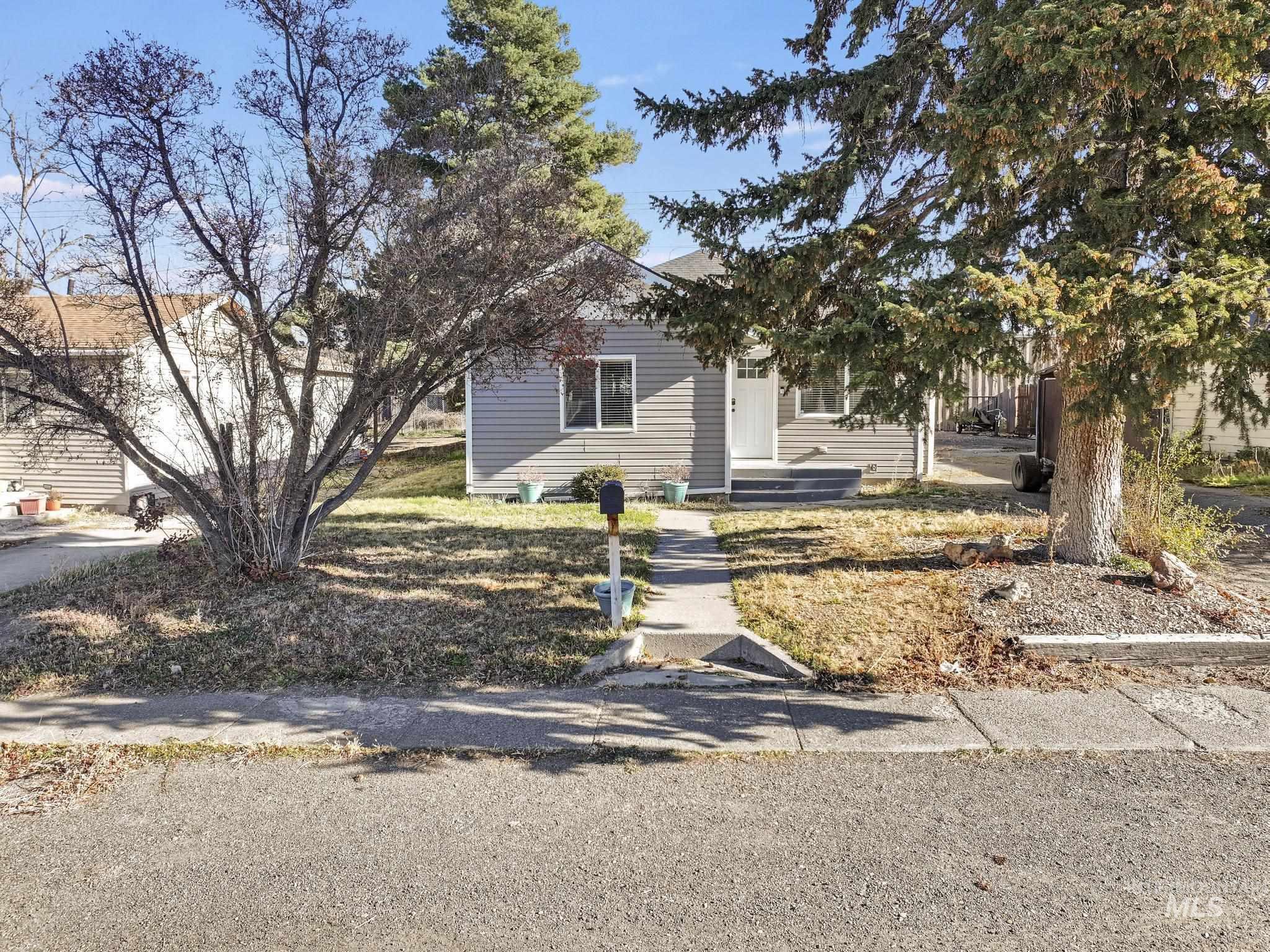 View of property hidden behind natural elements