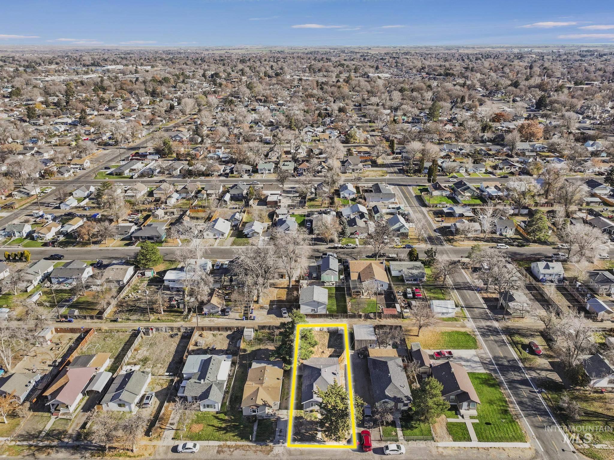 Aerial perspective of suburban area with property boundaries highlighted