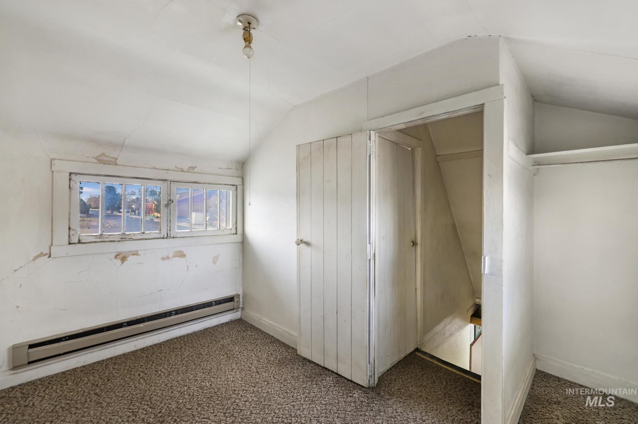 Closet with a baseboard radiator