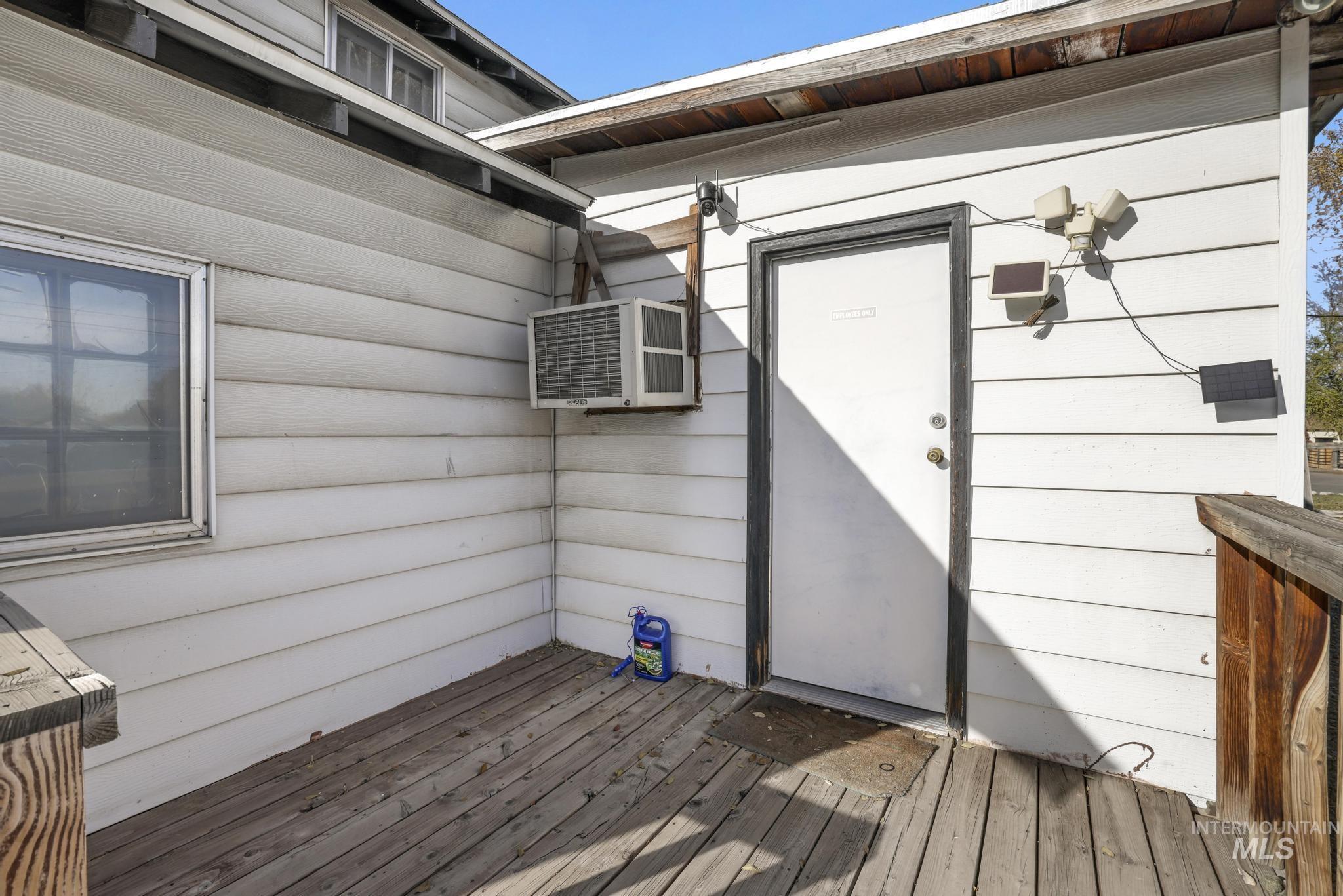 Doorway to property featuring a deck