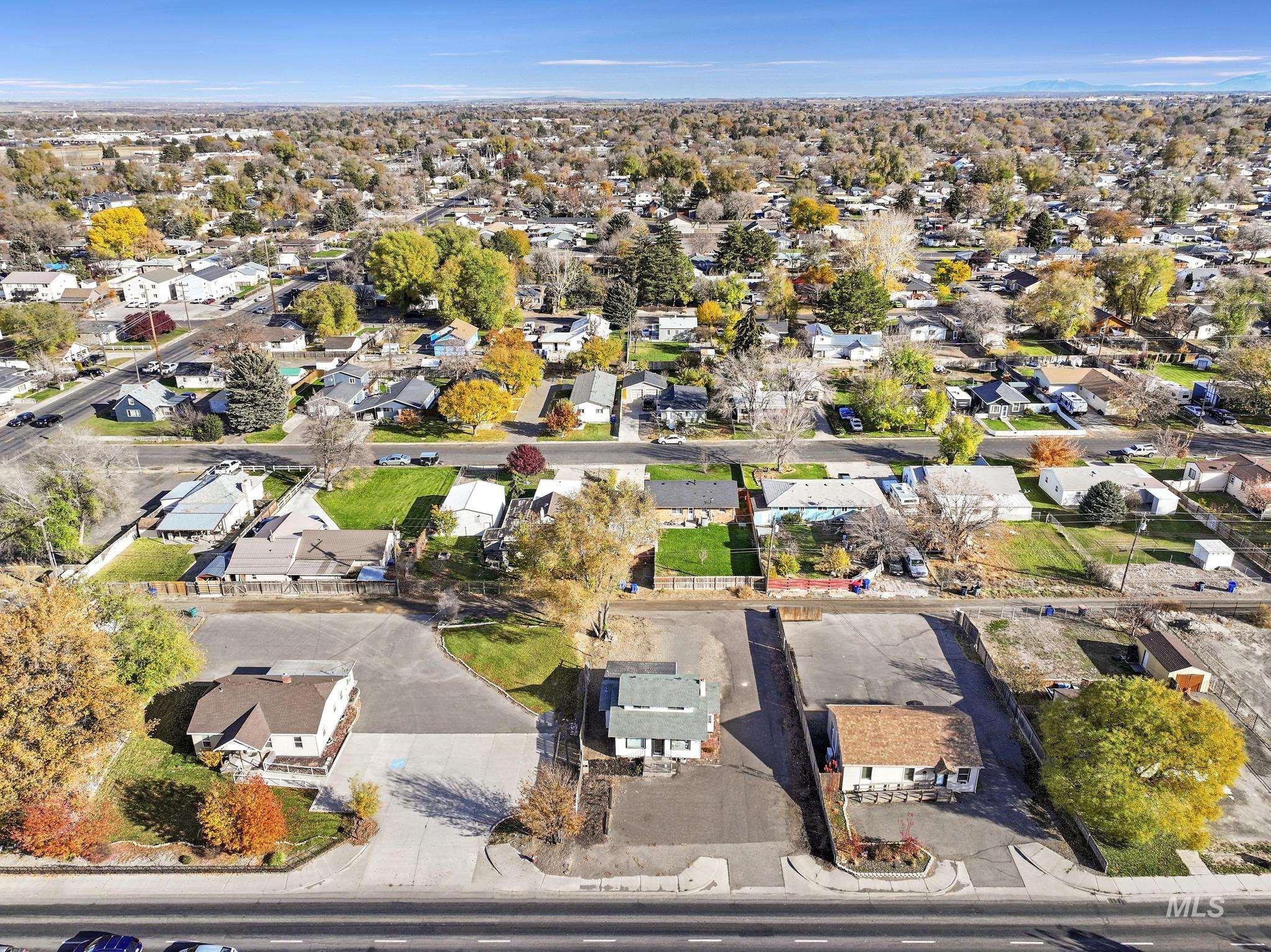 Aerial overview of property's location with nearby suburban area