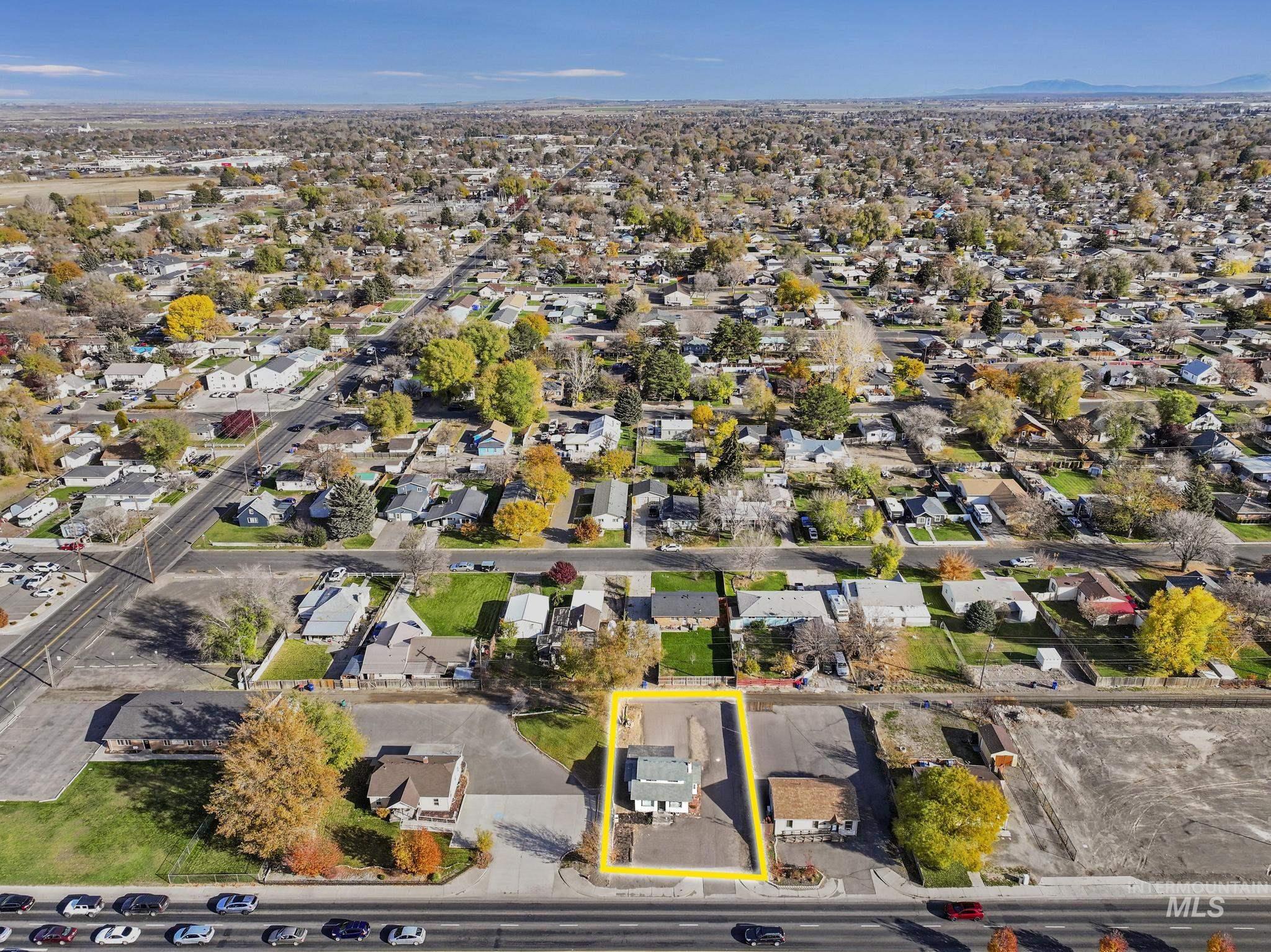 View of property location featuring nearby suburban area and property parcel outlined