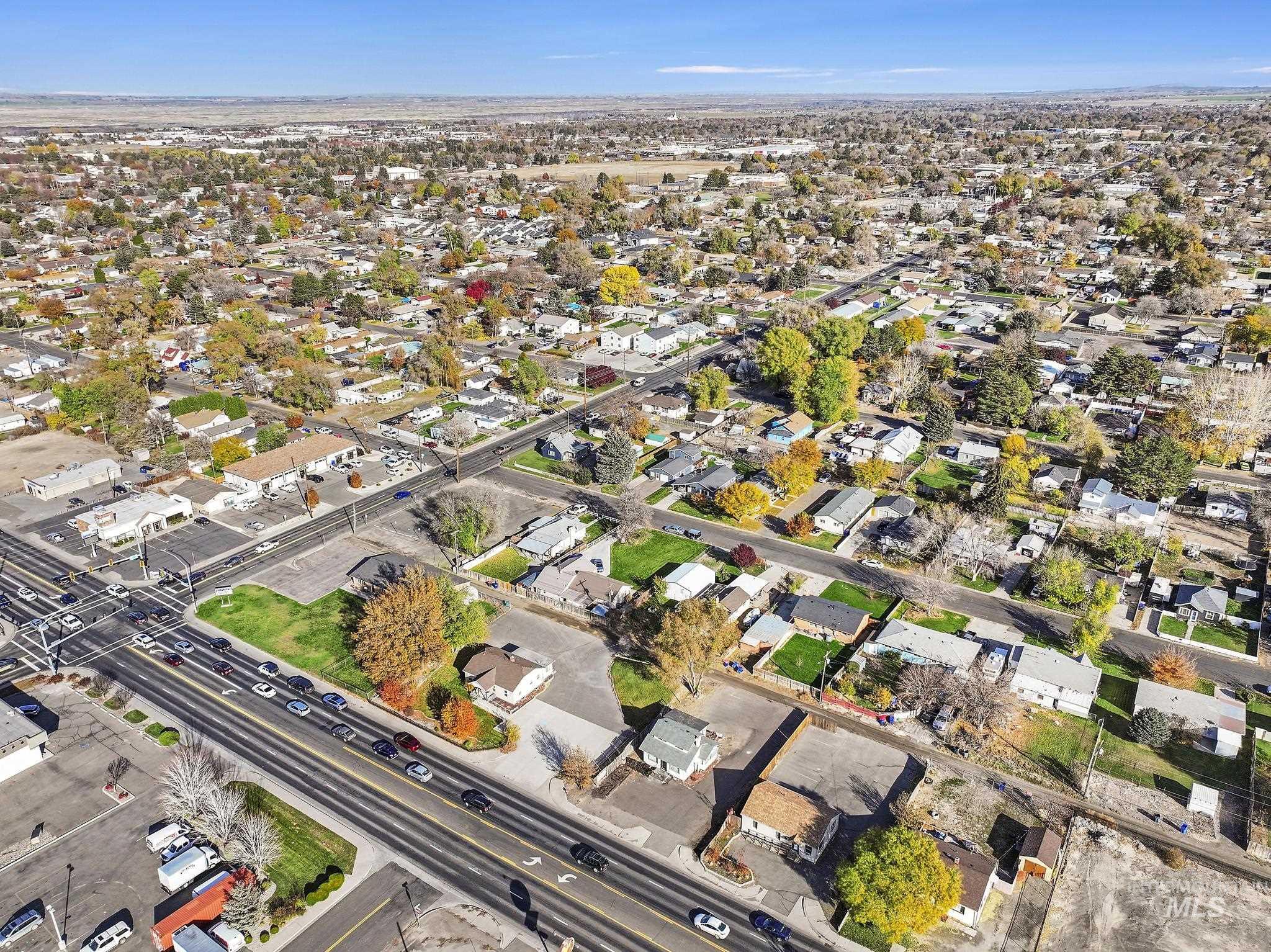 Aerial view of property's location with nearby suburban area