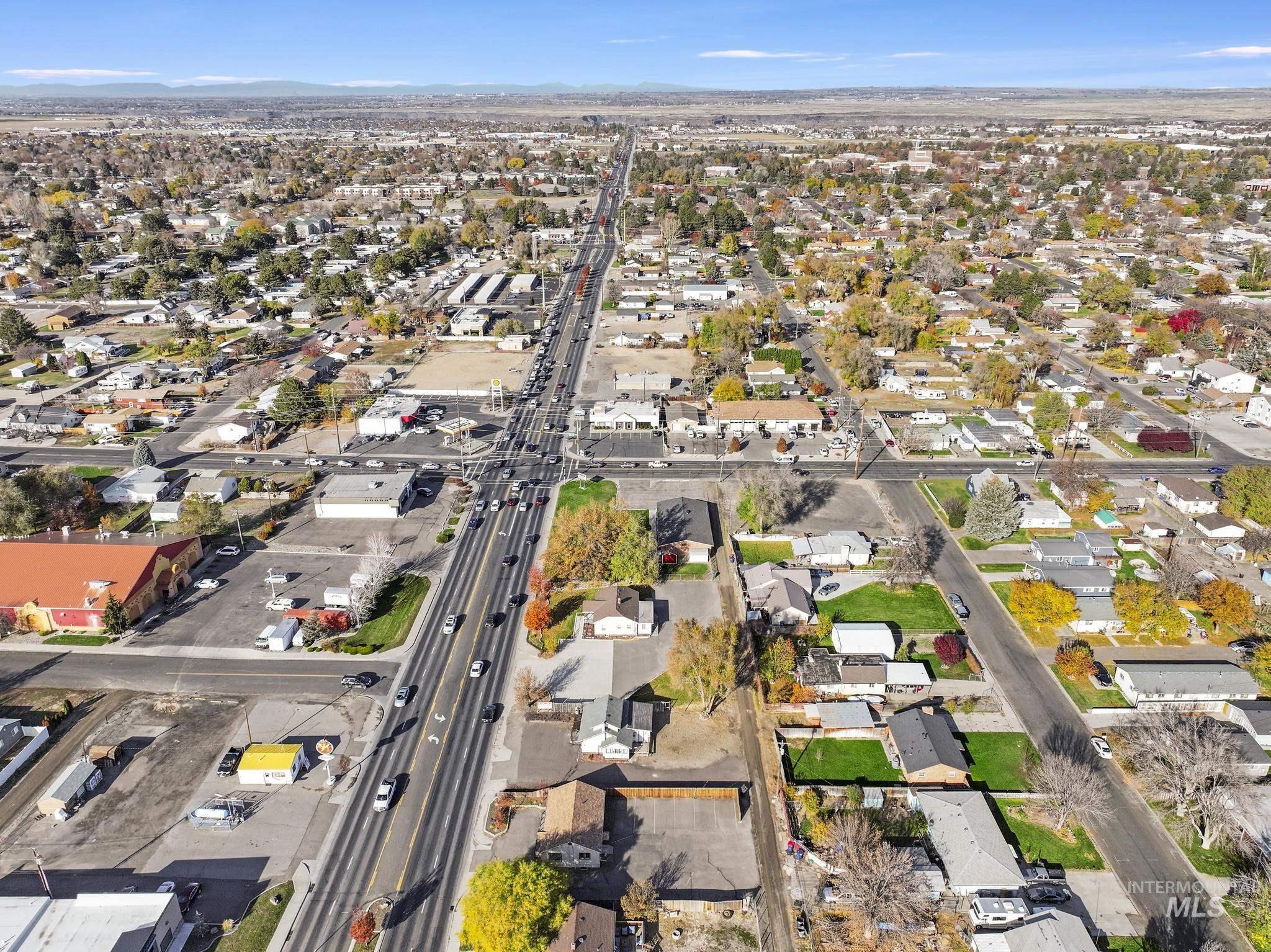 Aerial overview of property's location with nearby suburban area