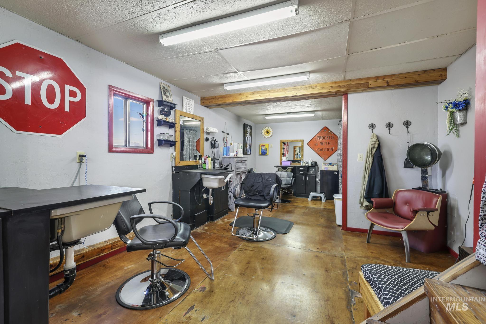 Misc room with baseboards and a drop ceiling