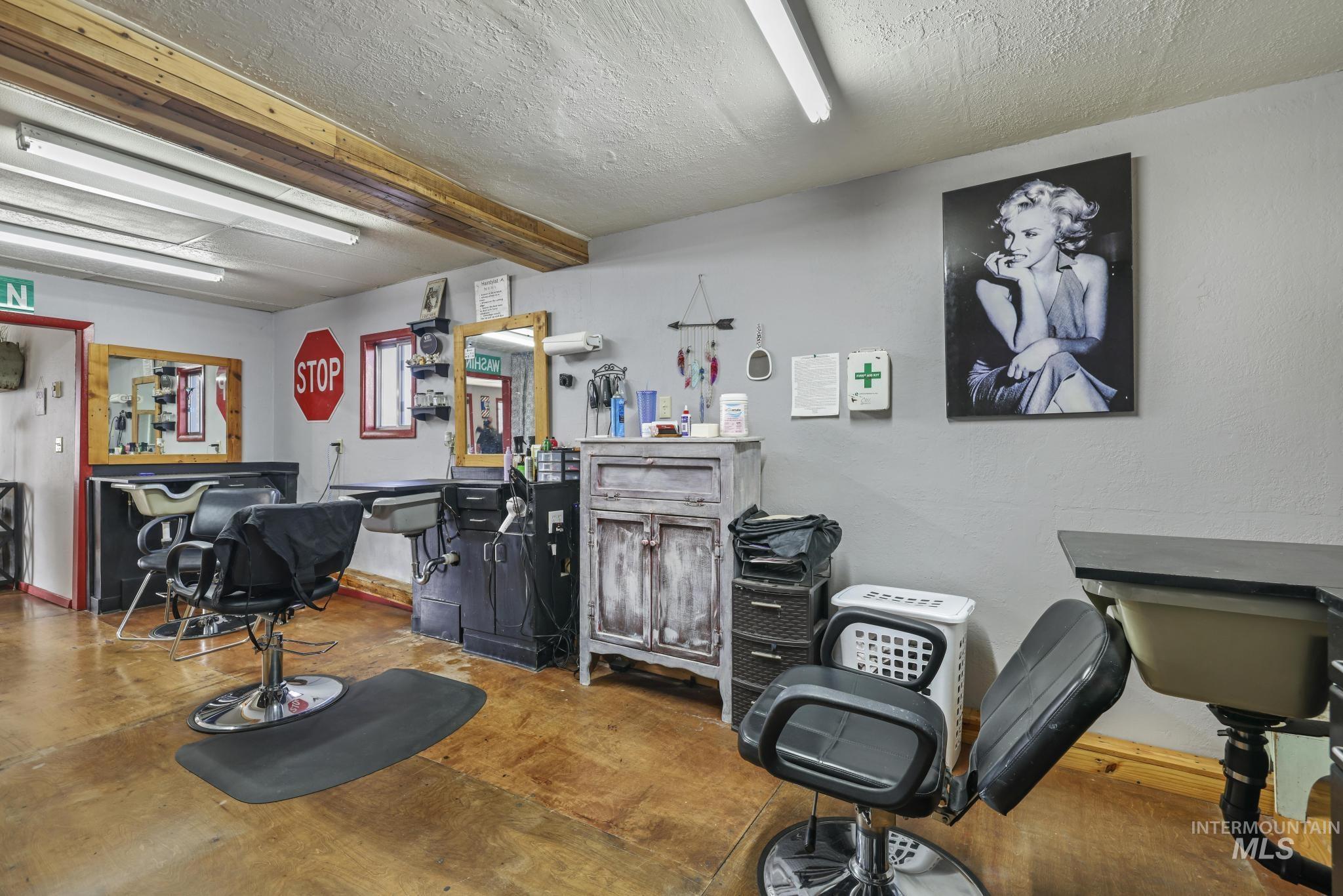 Misc room with a dry bar and a textured ceiling