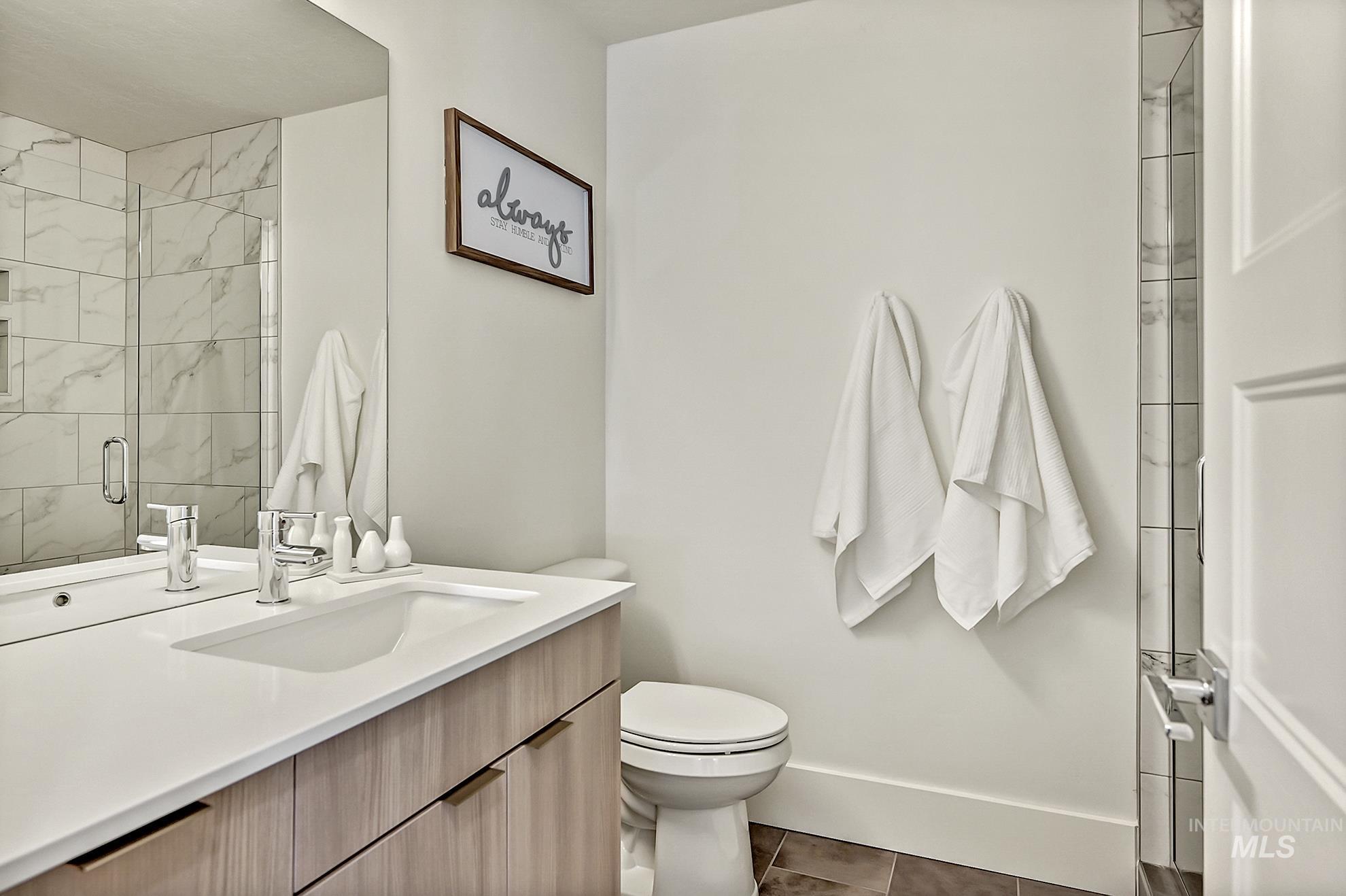 Bathroom with vanity and a shower stall