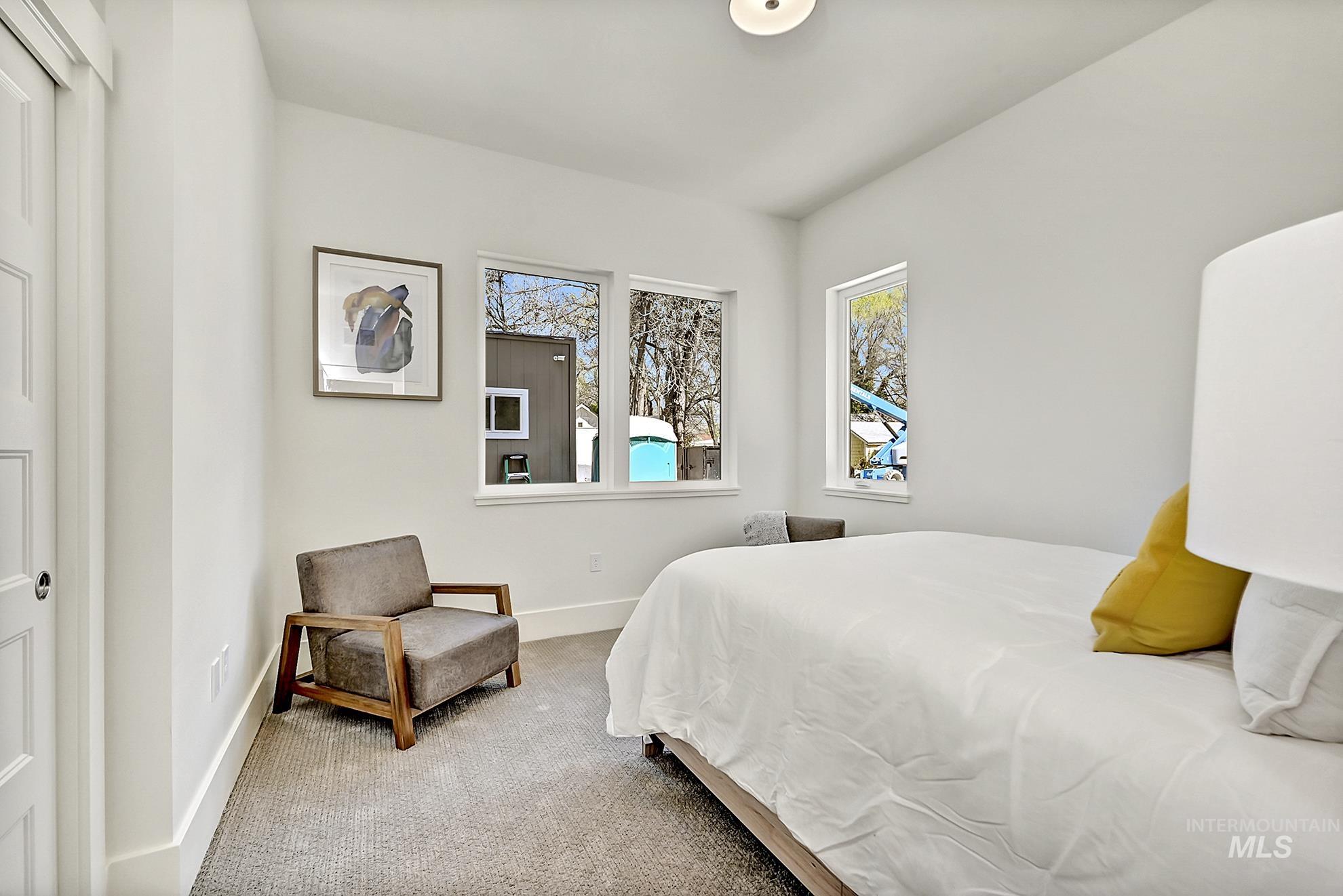 Carpeted bedroom with baseboards