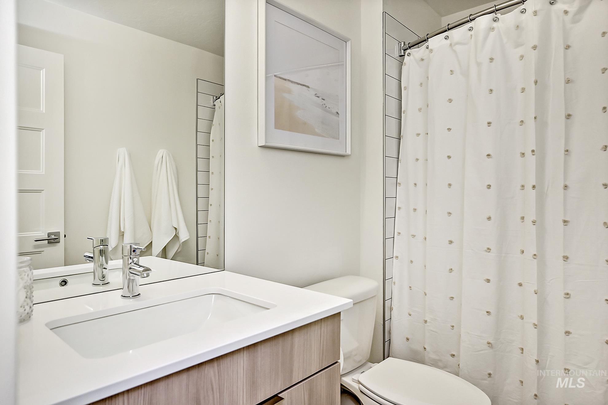 Bathroom featuring vanity and a shower with curtain