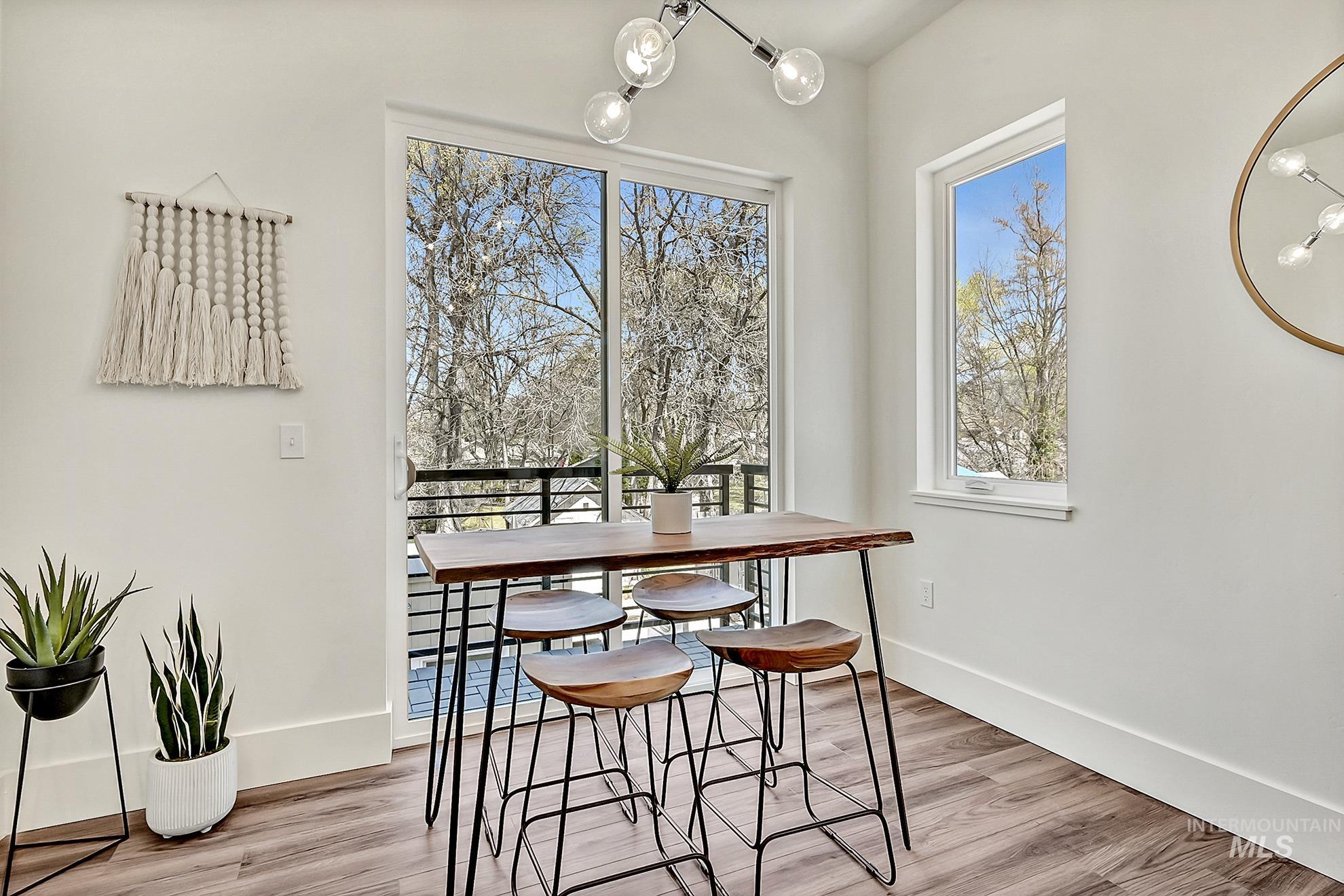 Dining area with light wood finished floors and baseboards