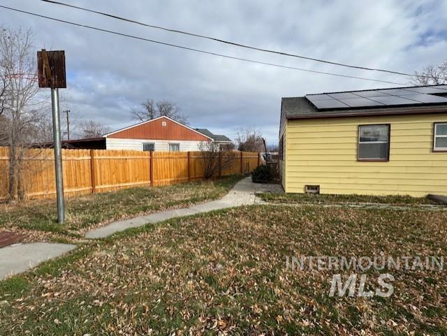 View of fenced backyard