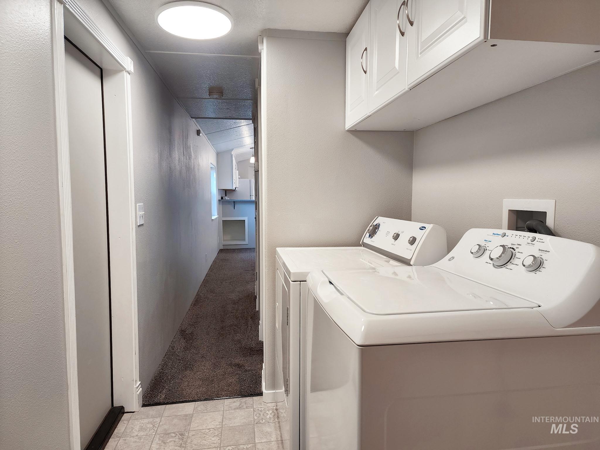 Convenient laundry space with included washer and dryer, overhead storage, and easy access from the main living areas. Clean, functional, and ready for everyday use.