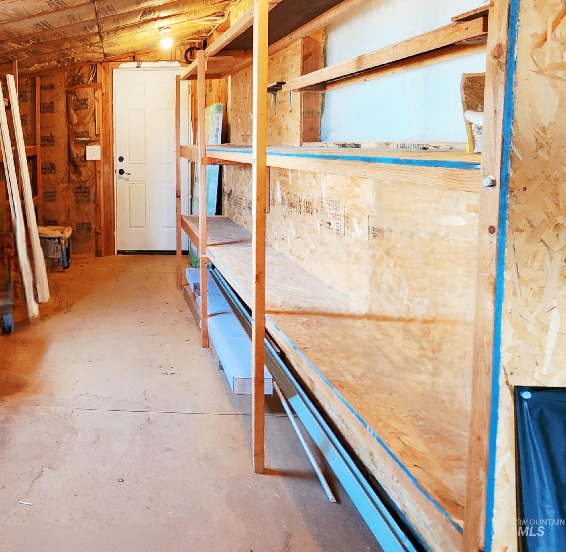 Spacious storage area with built-in shelving, great lighting, and plenty of room for tools, projects, or outdoor gear. A versatile bonus space that adds real functionality to the property.