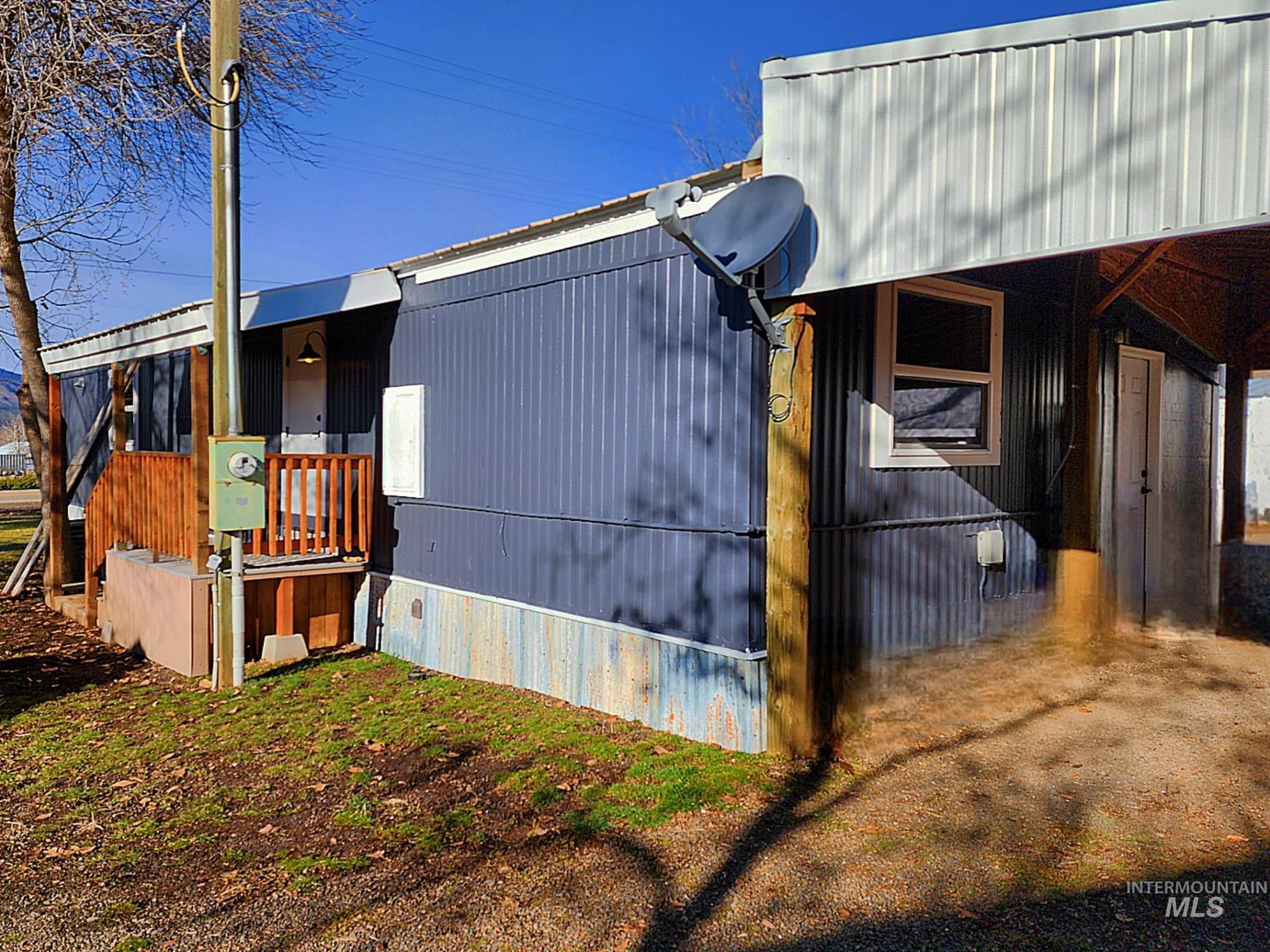 Updated exterior with fresh paint, covered entry, and convenient side access. Clean lines, durable finishes, and space for parking or projects make this home a solid fit for low-maintenance Idaho living.
