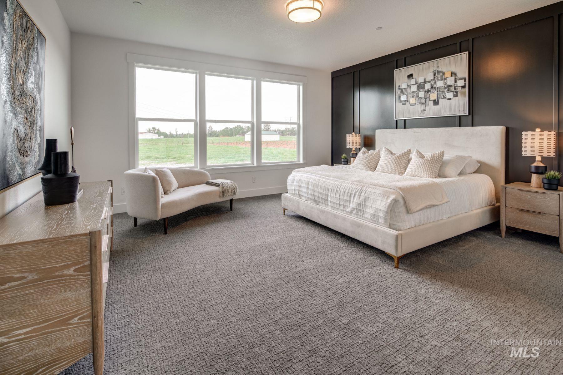 Carpeted bedroom featuring baseboards