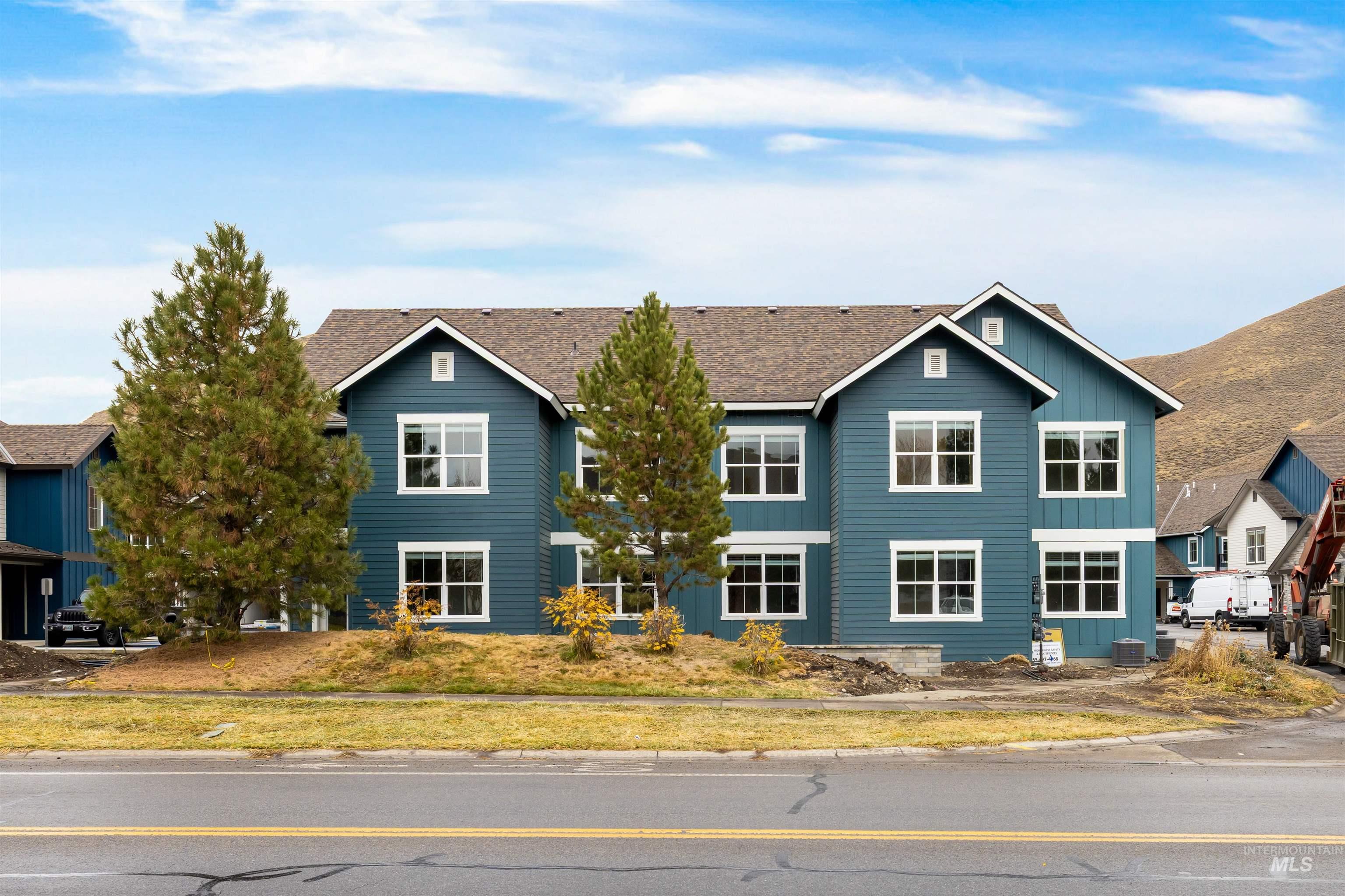 View of front facade with board and batten siding and a residential view