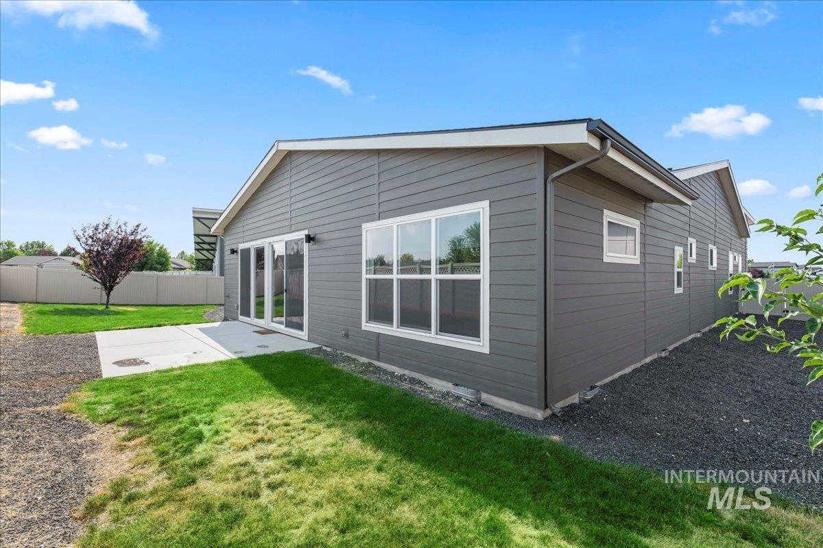 Back of house with a patio