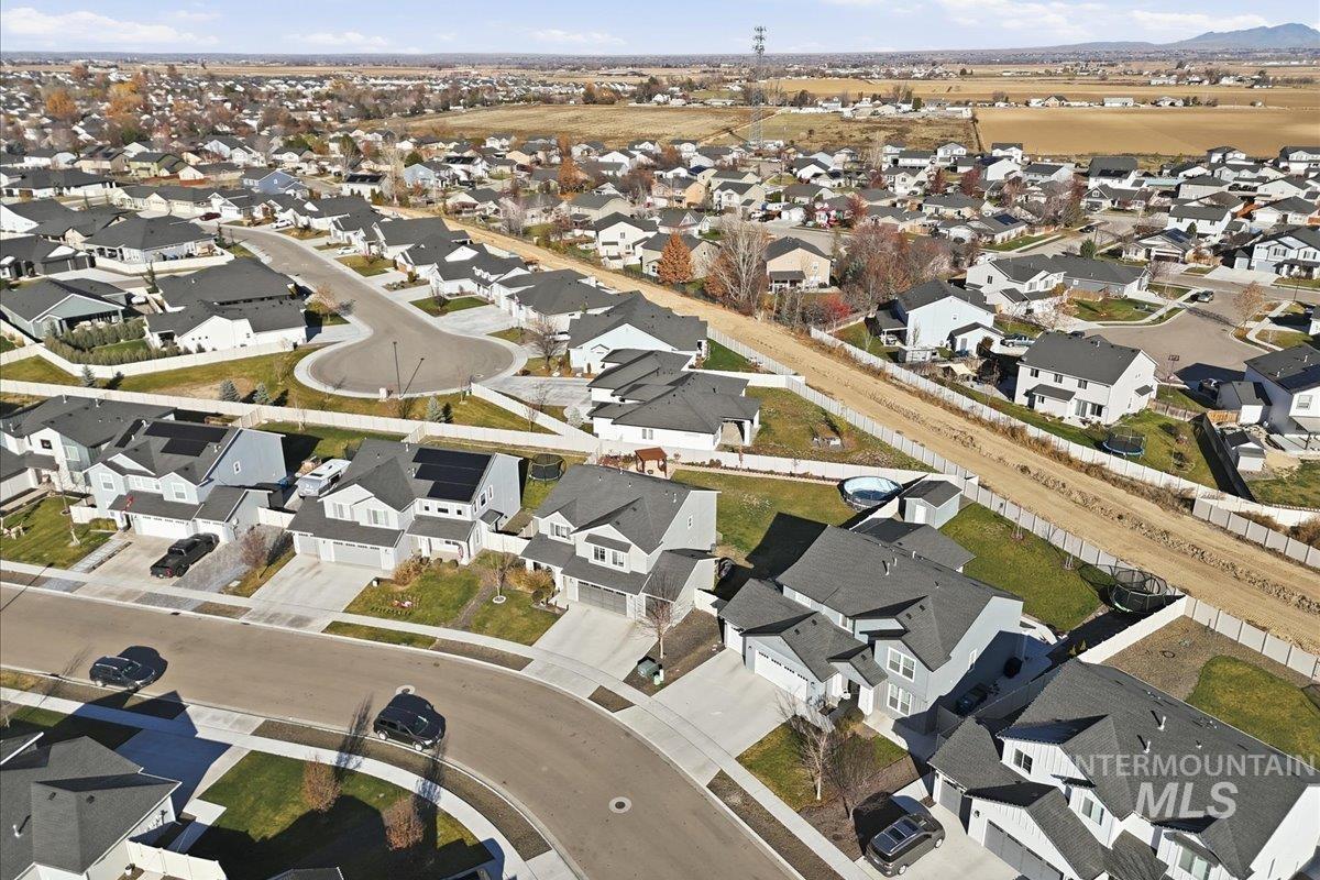 Aerial view of property's location with nearby suburban area