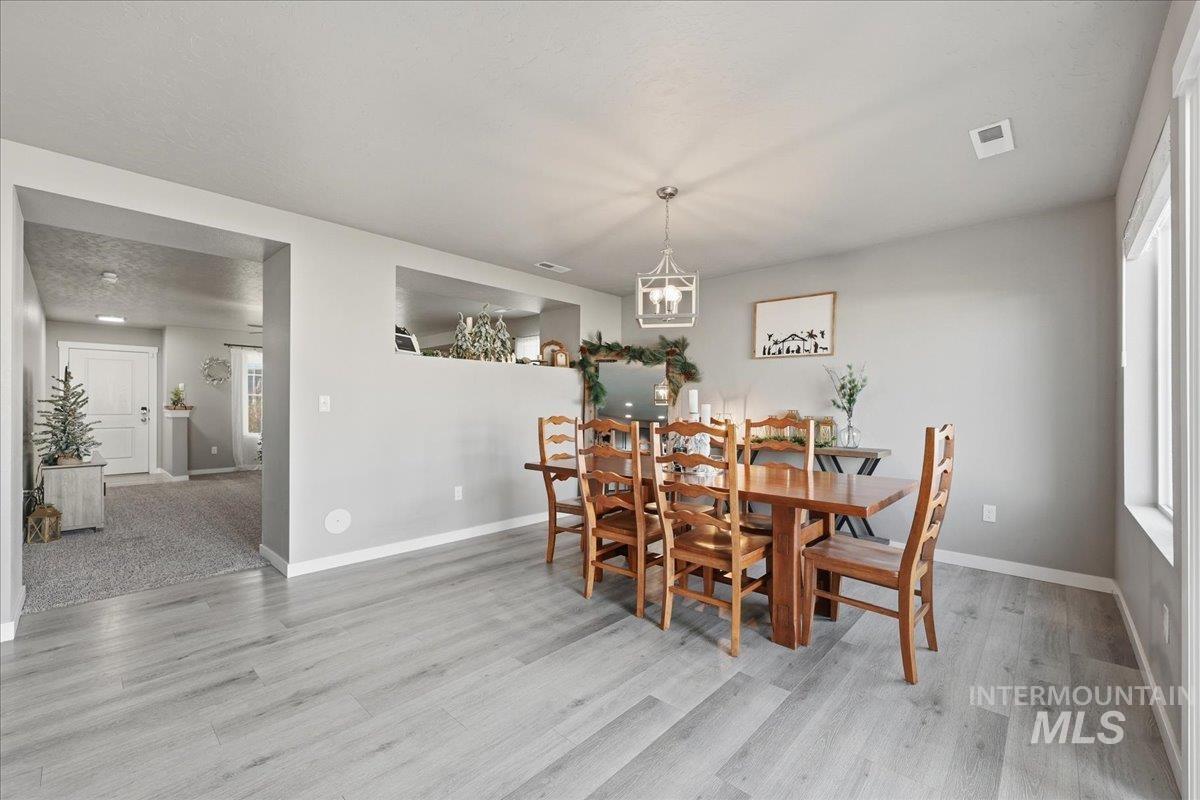 Dining room with light wood-style flooring