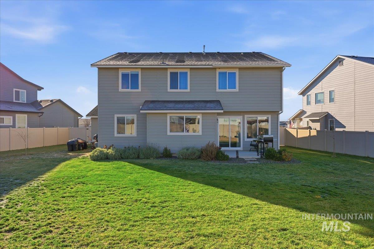 Back of house featuring a patio and a fenced backyard
