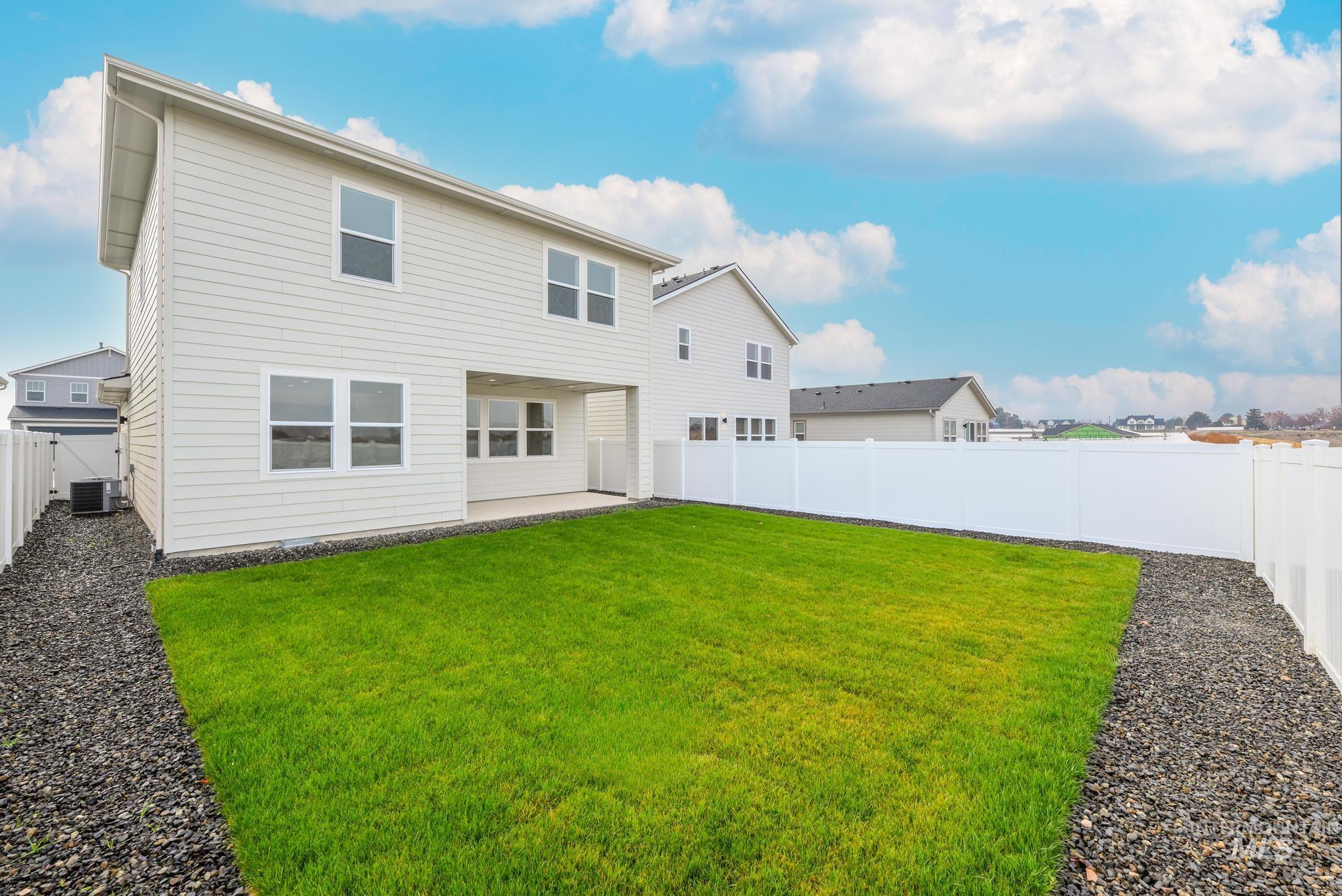 Back of house with a patio and a fenced backyard