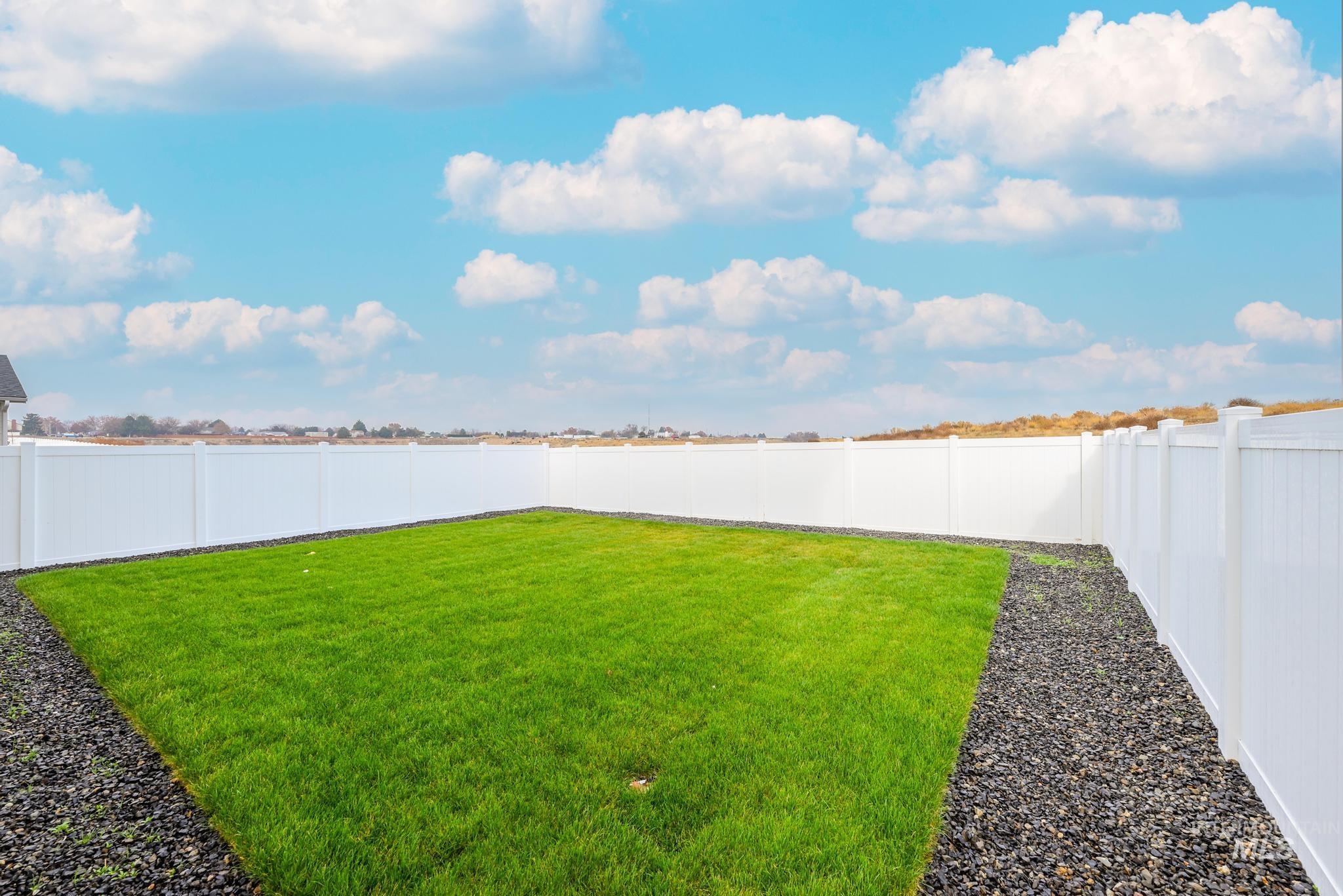 View of fenced backyard