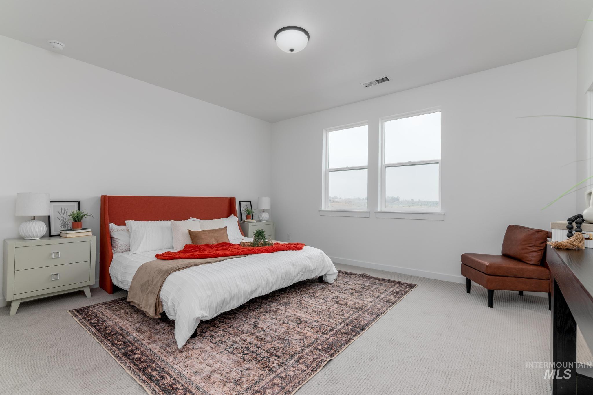 Carpeted bedroom featuring baseboards