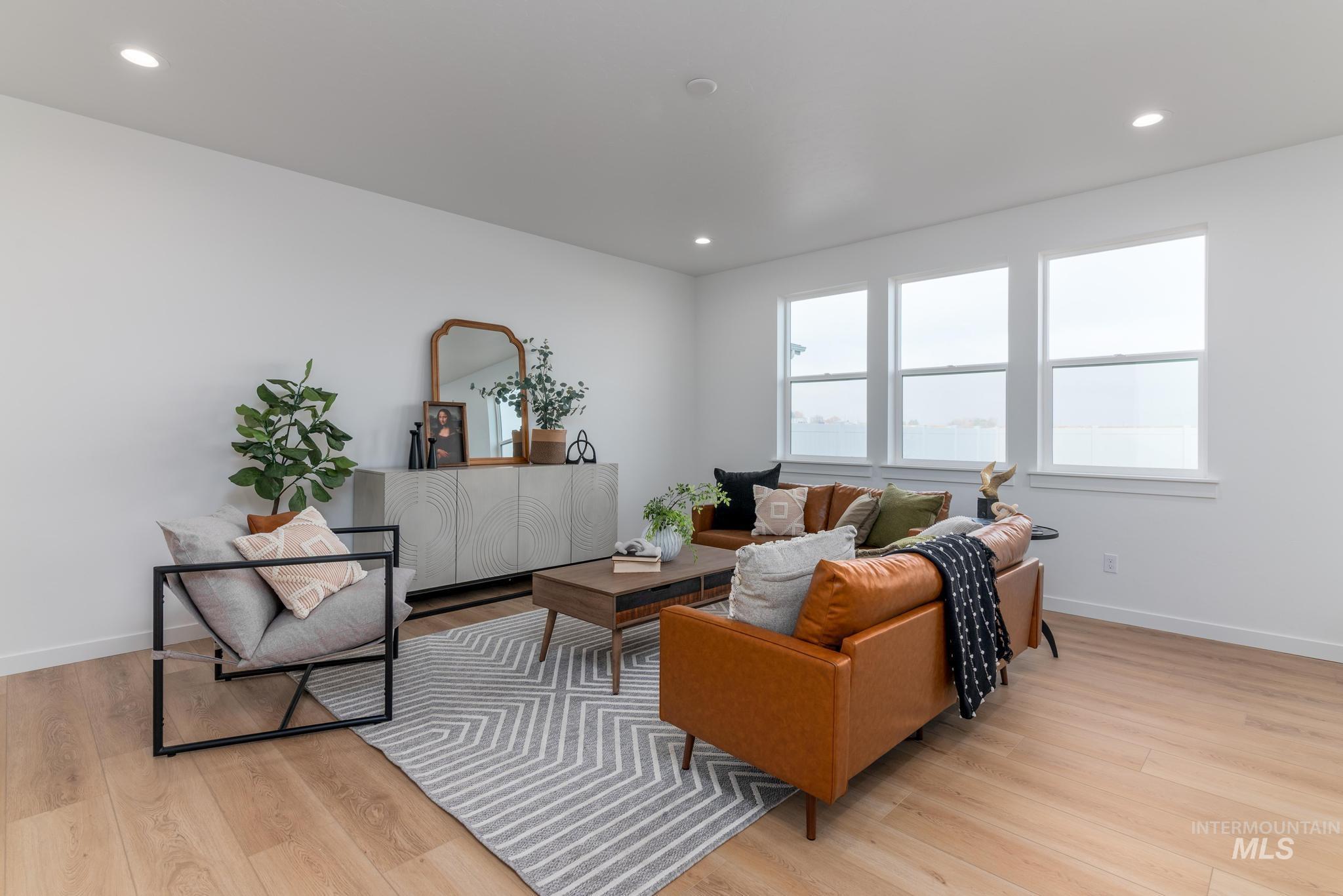 Living room featuring recessed lighting and light wood-type flooring