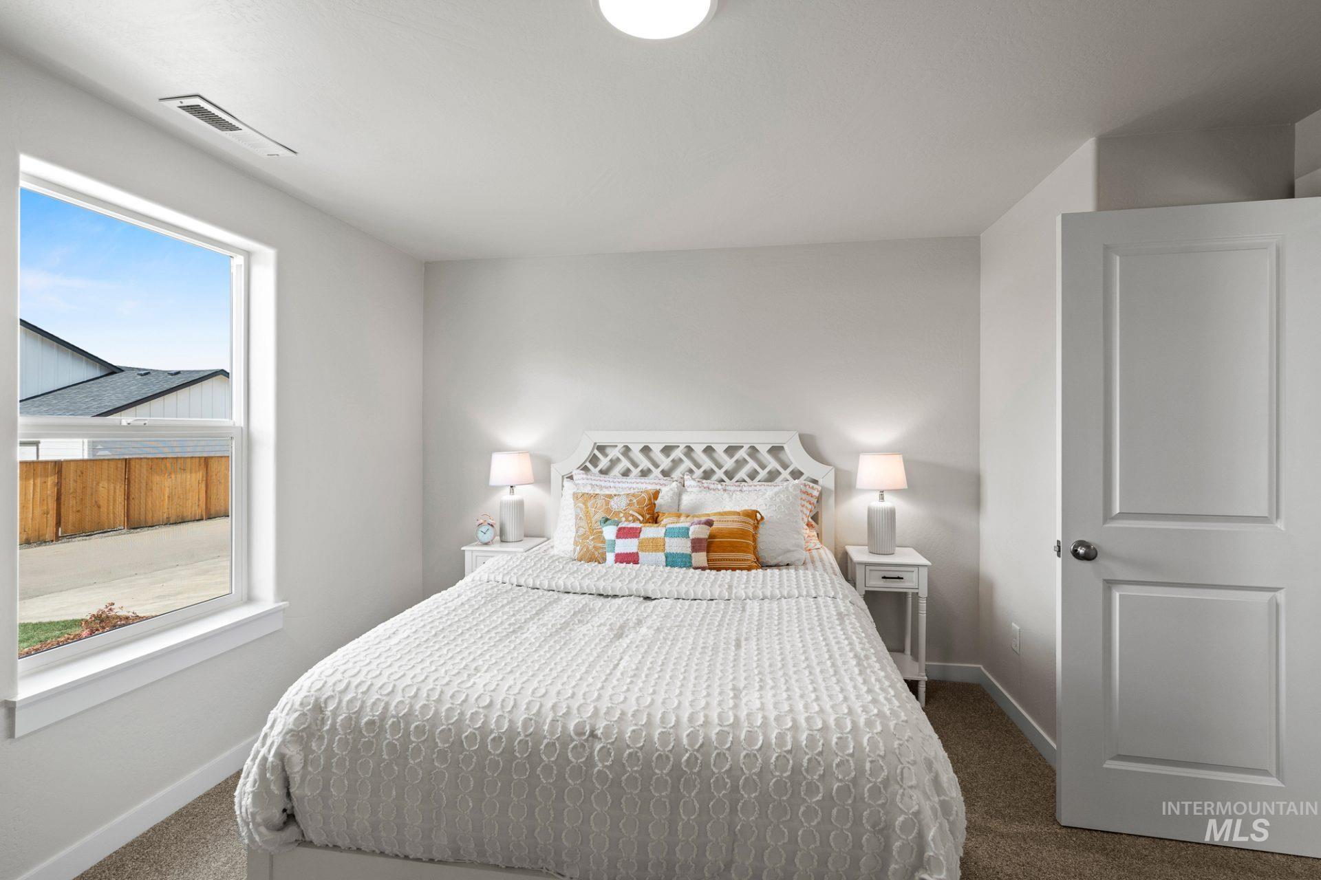 Bedroom with carpet and baseboards