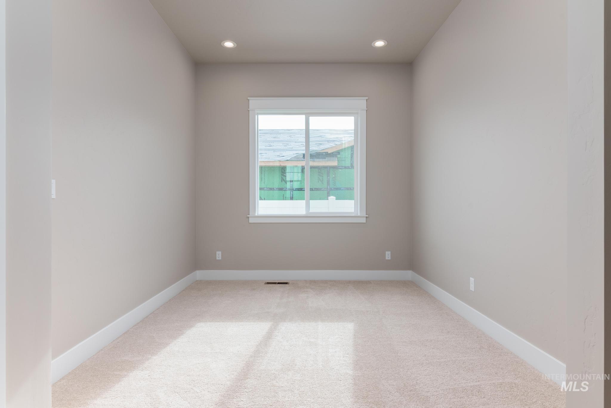 Unfurnished room featuring light colored carpet and recessed lighting