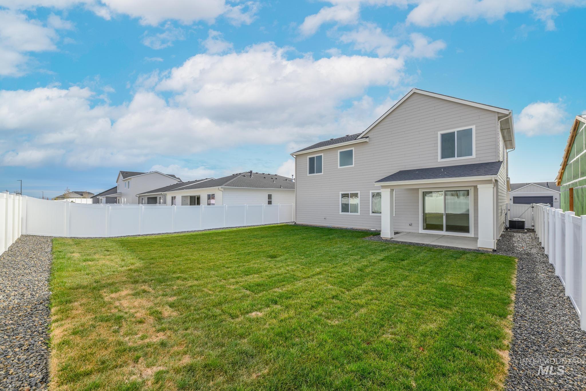 Back of house featuring a patio and a fenced backyard
