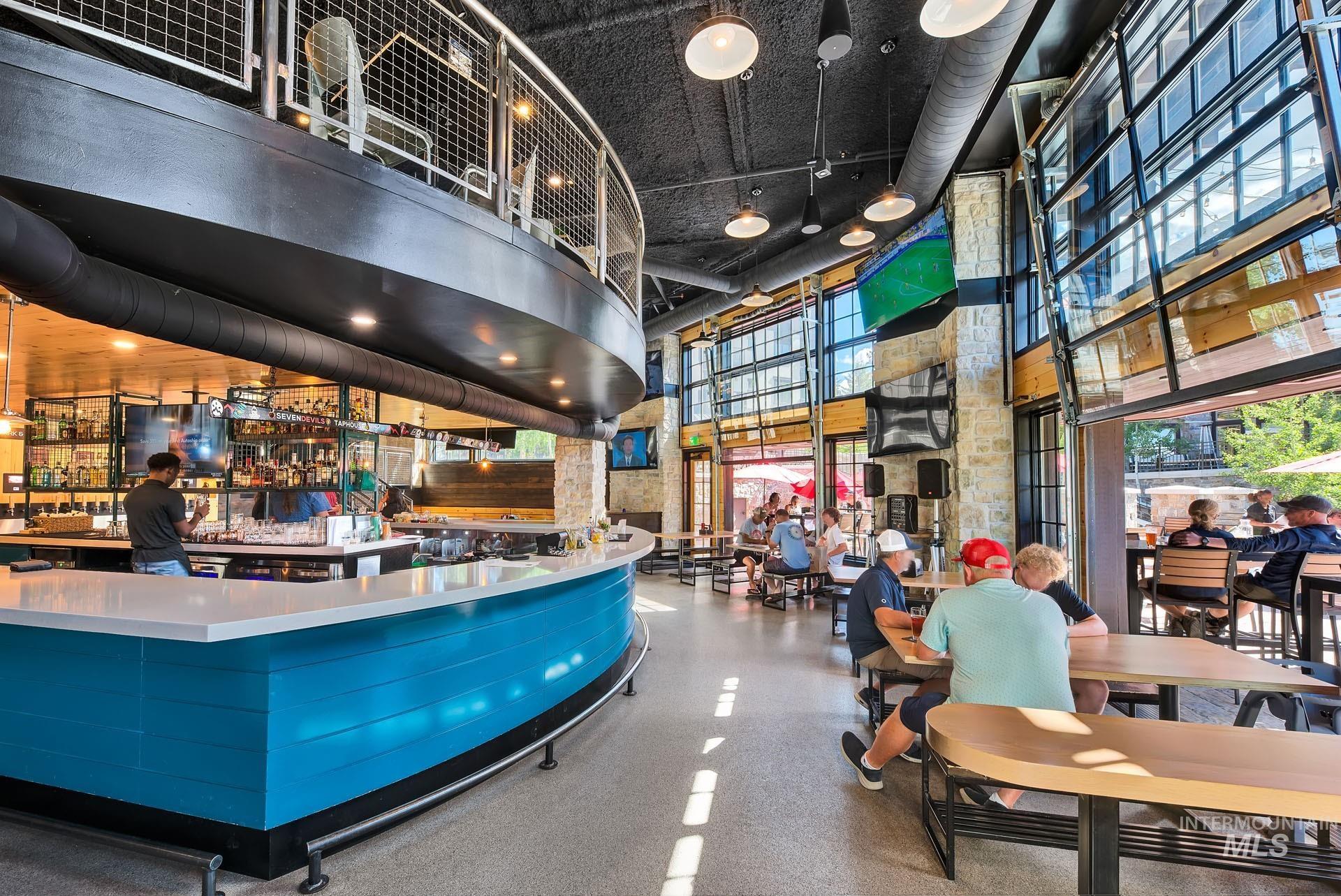 Welcome area with a high ceiling and expansive windows