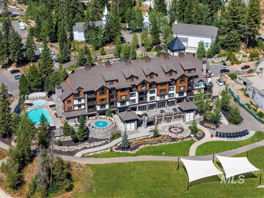 Aerial view of property's location with a pool